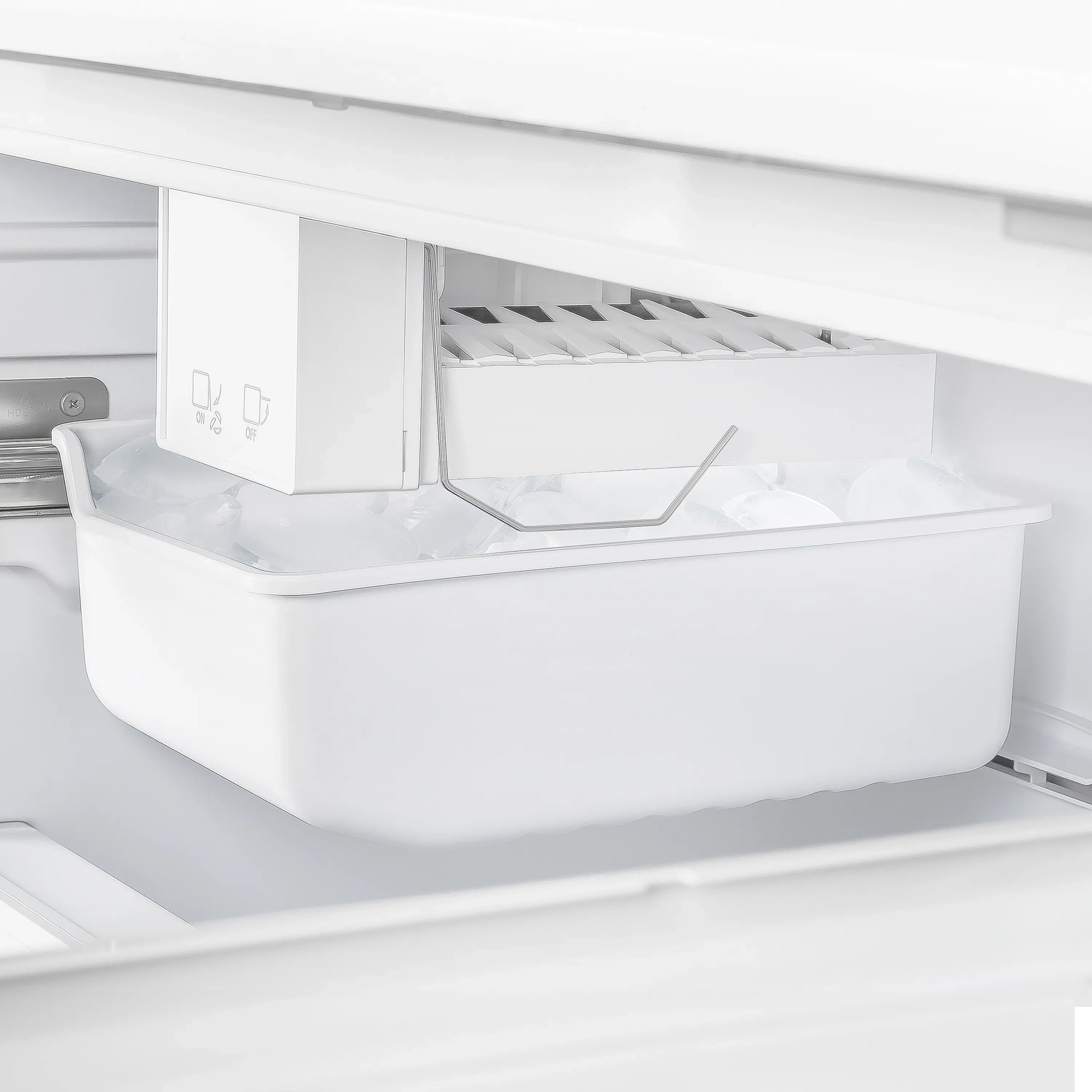 White freezer section with internal bin and control icons under the upper compartment.