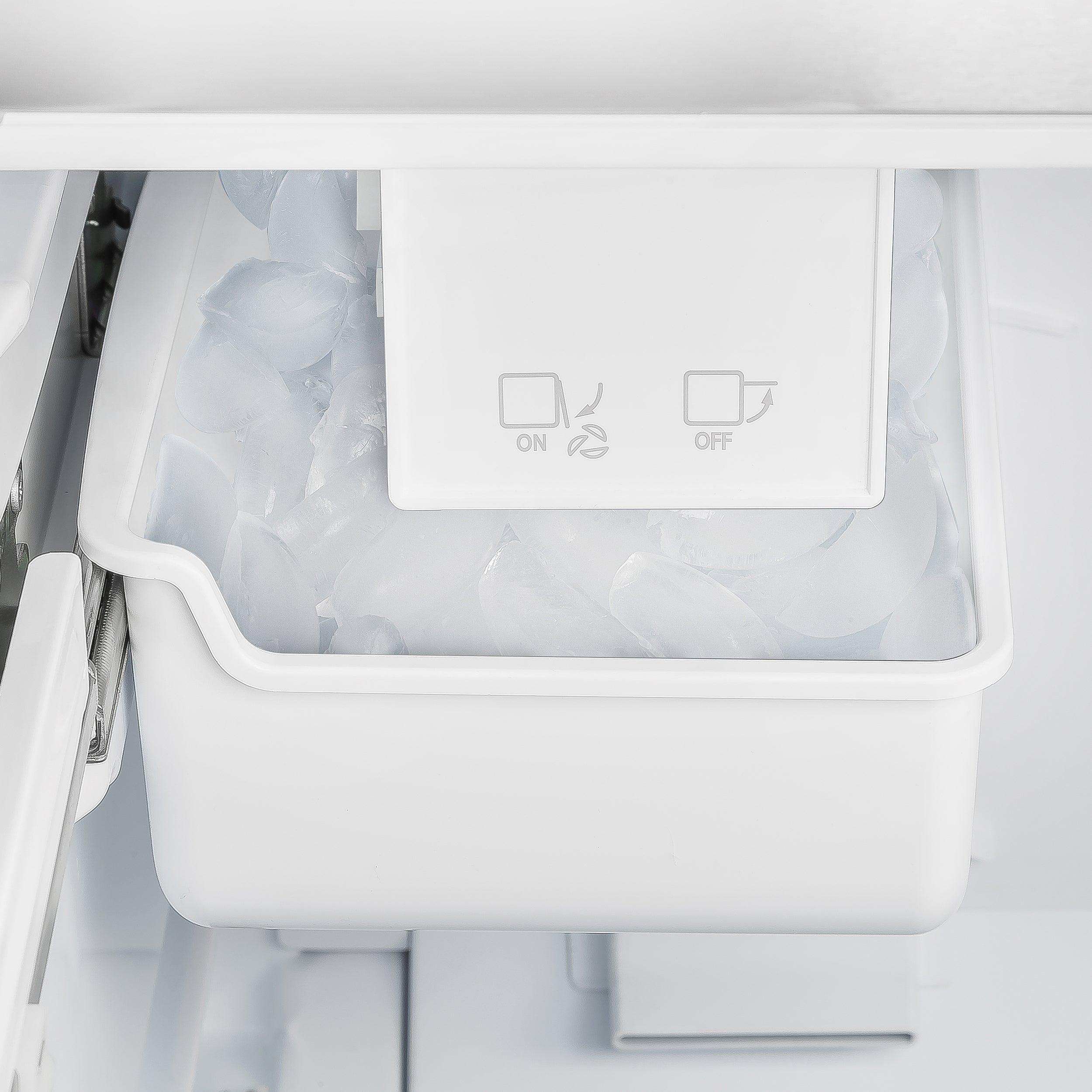 White refrigerator freezer drawer with transparent ice storage bin
