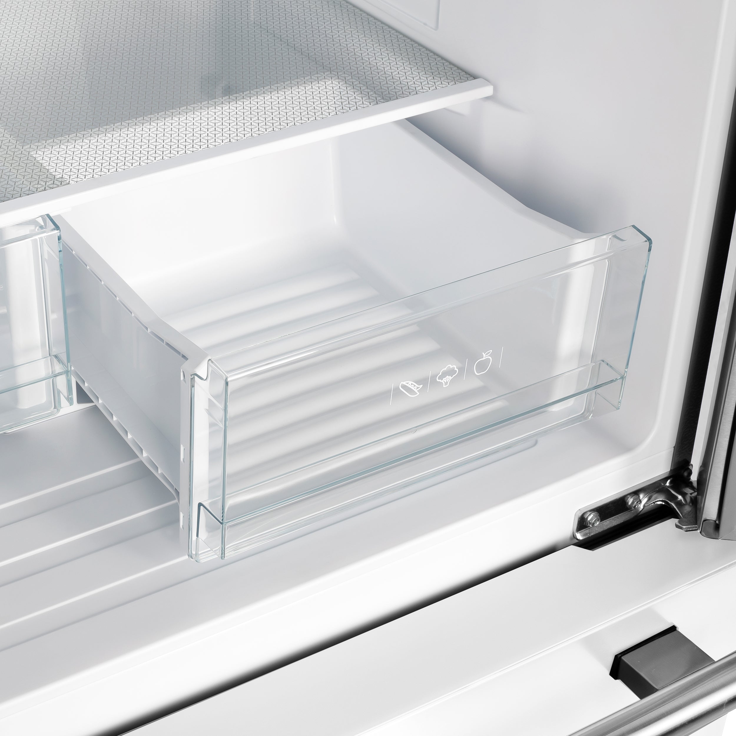 White French door refrigerator with clear crisper drawer and glass shelf inside
