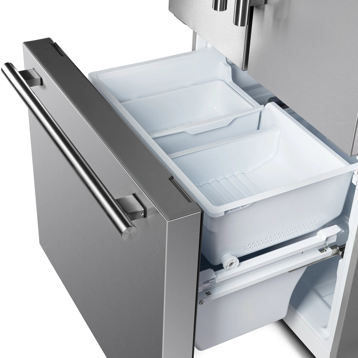 Ice maker bin area inside refrigerator with two plastic trays and molded compartments