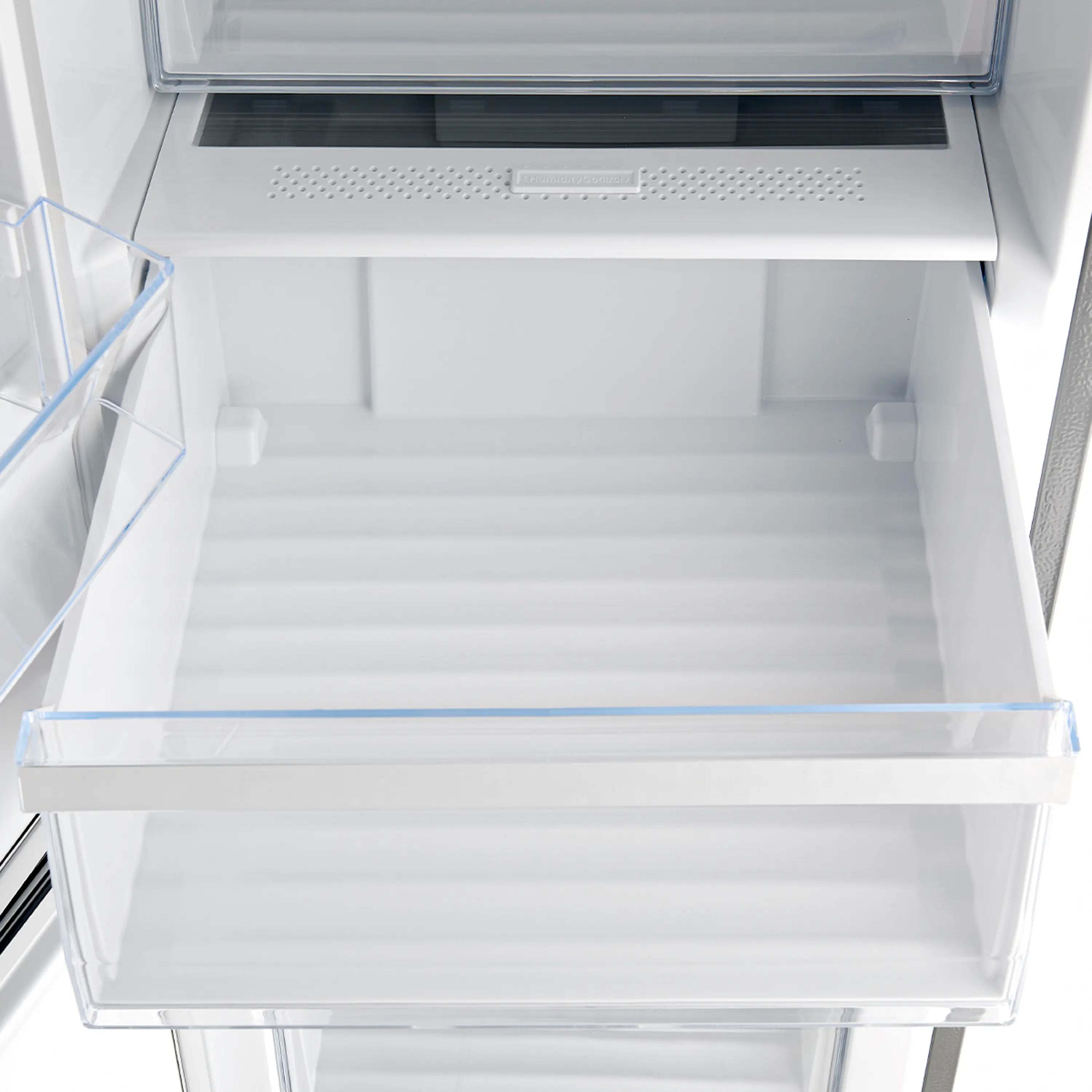 Stainless steel refrigerator crisper drawer area with vented panel above and glass shelf