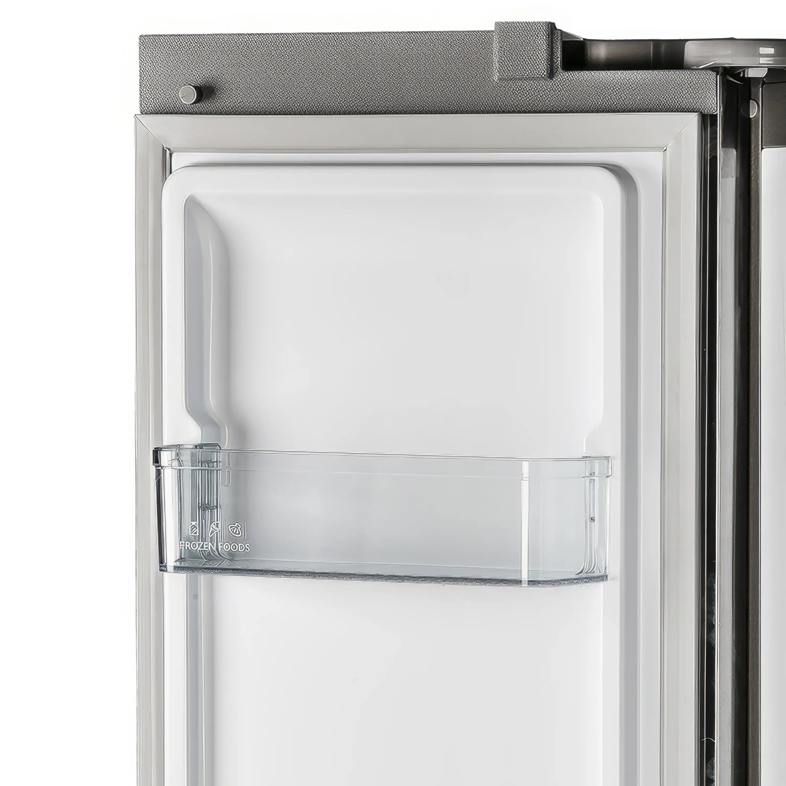 Built-in refrigerator door compartment with clear bin and white interior storage panel