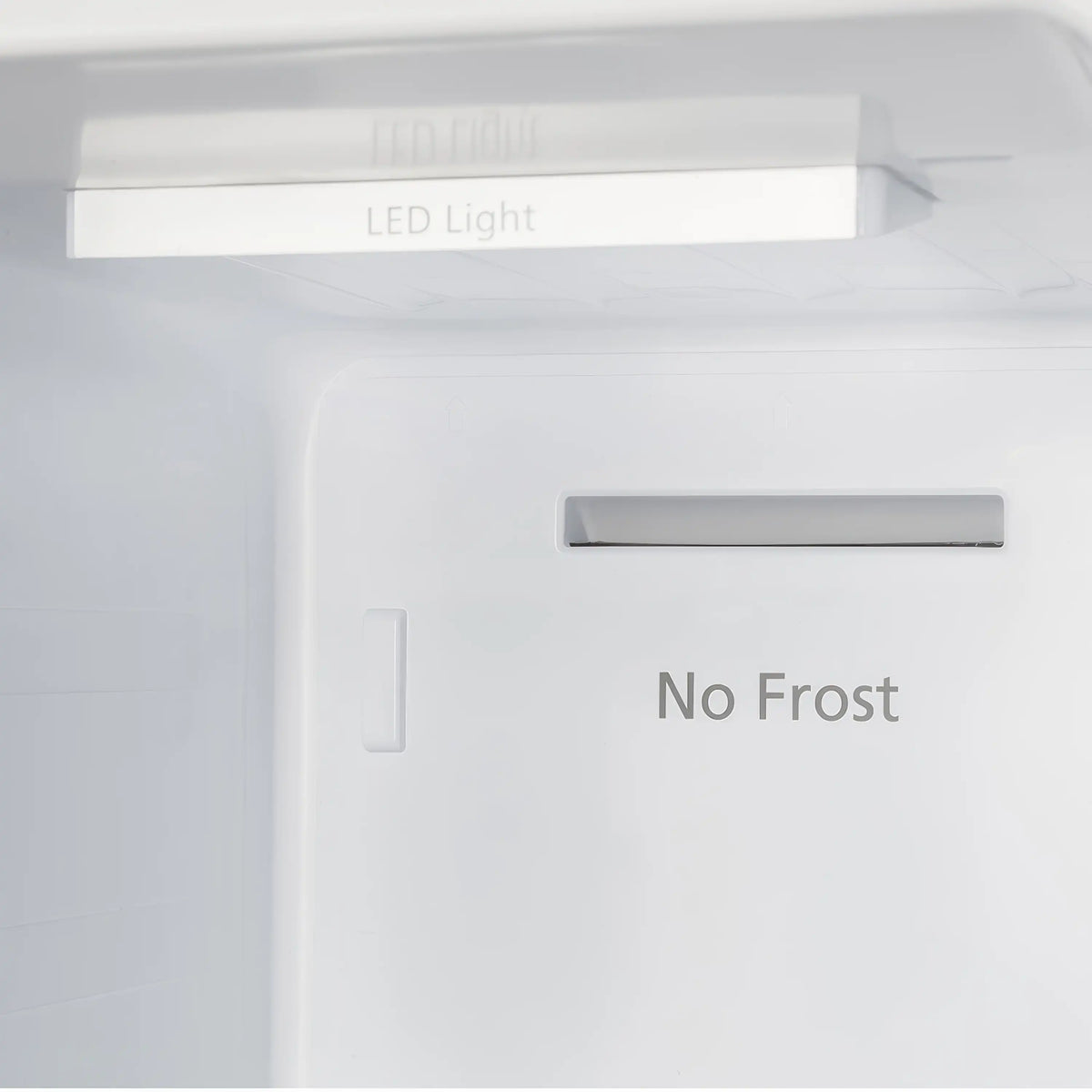 Refrigerator interior ceiling lights and “No Frost” panel on the back wall