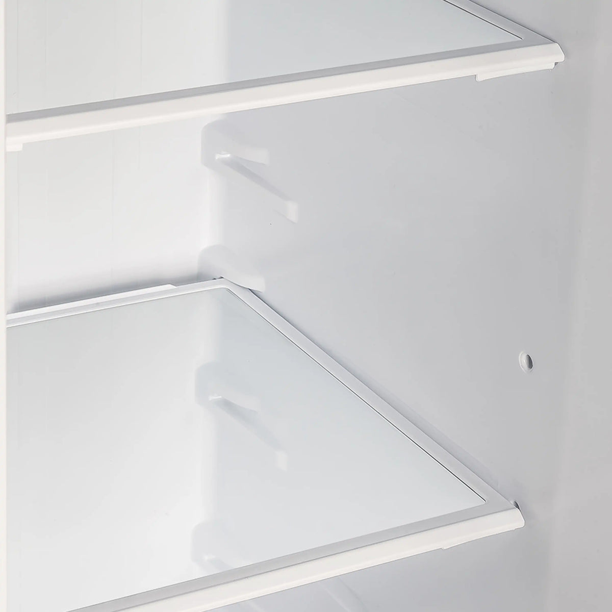 Refrigerator interior with white back panel and clear, removable shelf with side rails