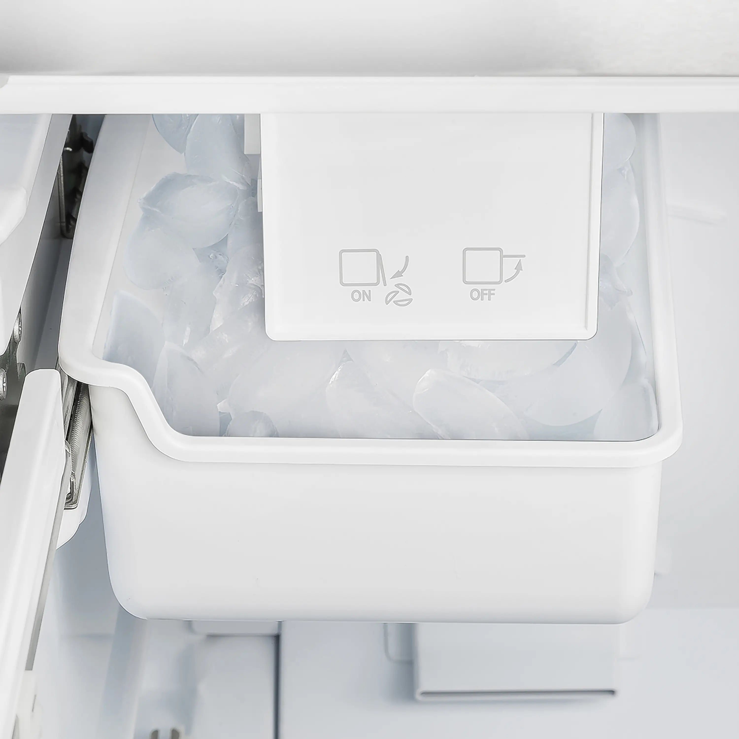 Refrigerator ice bin compartment with control icons on front panel