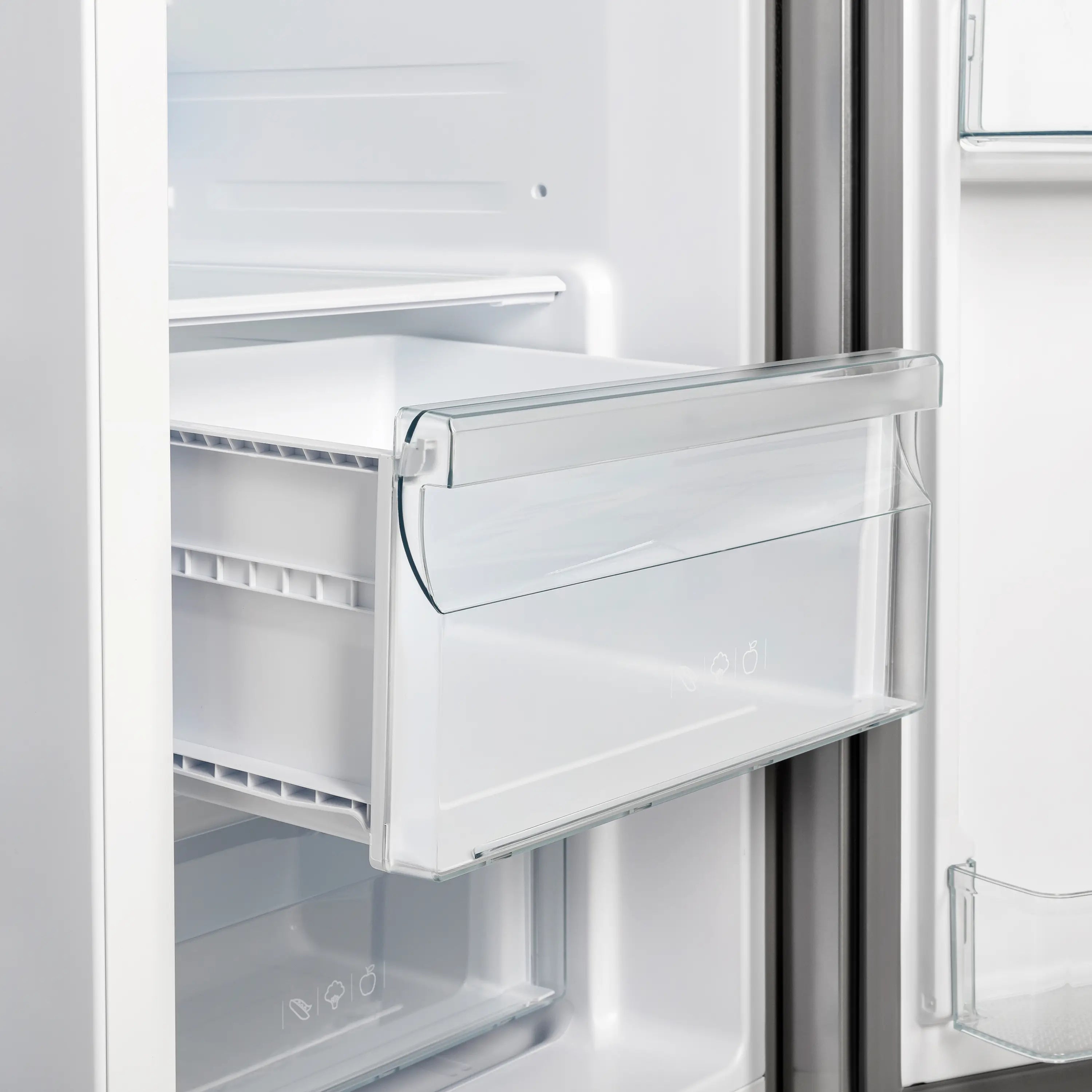 Refrigerator interior with slide-out shelves and clear door storage bin