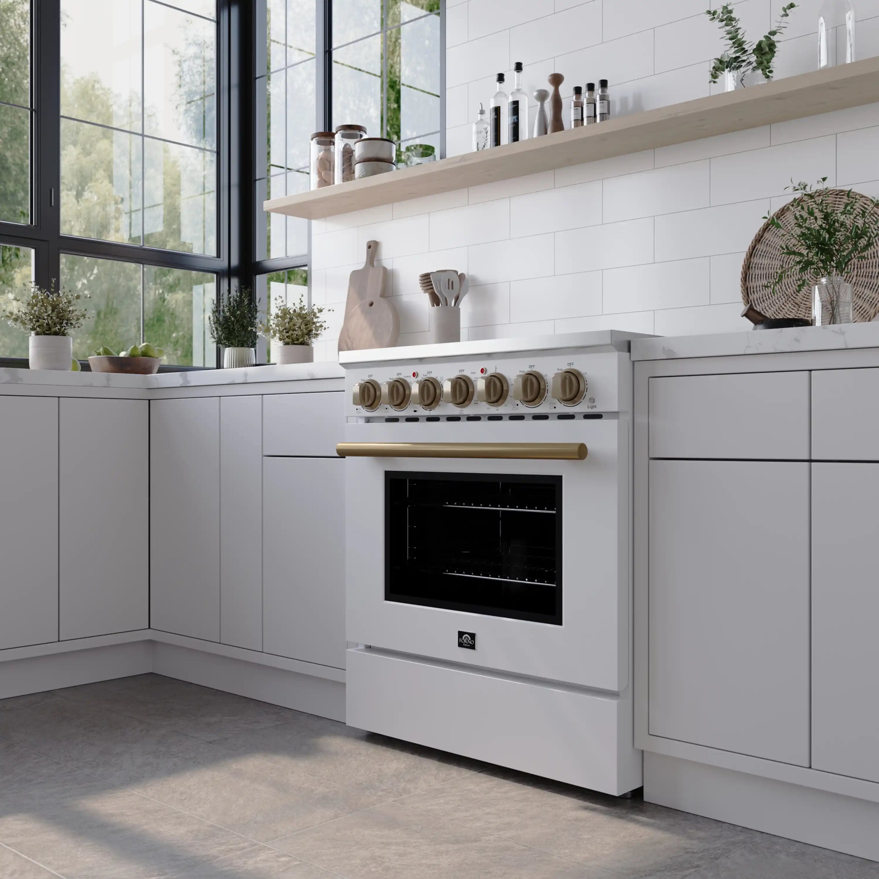 White freestanding electric range with brass knobs and glass oven door in kitchen