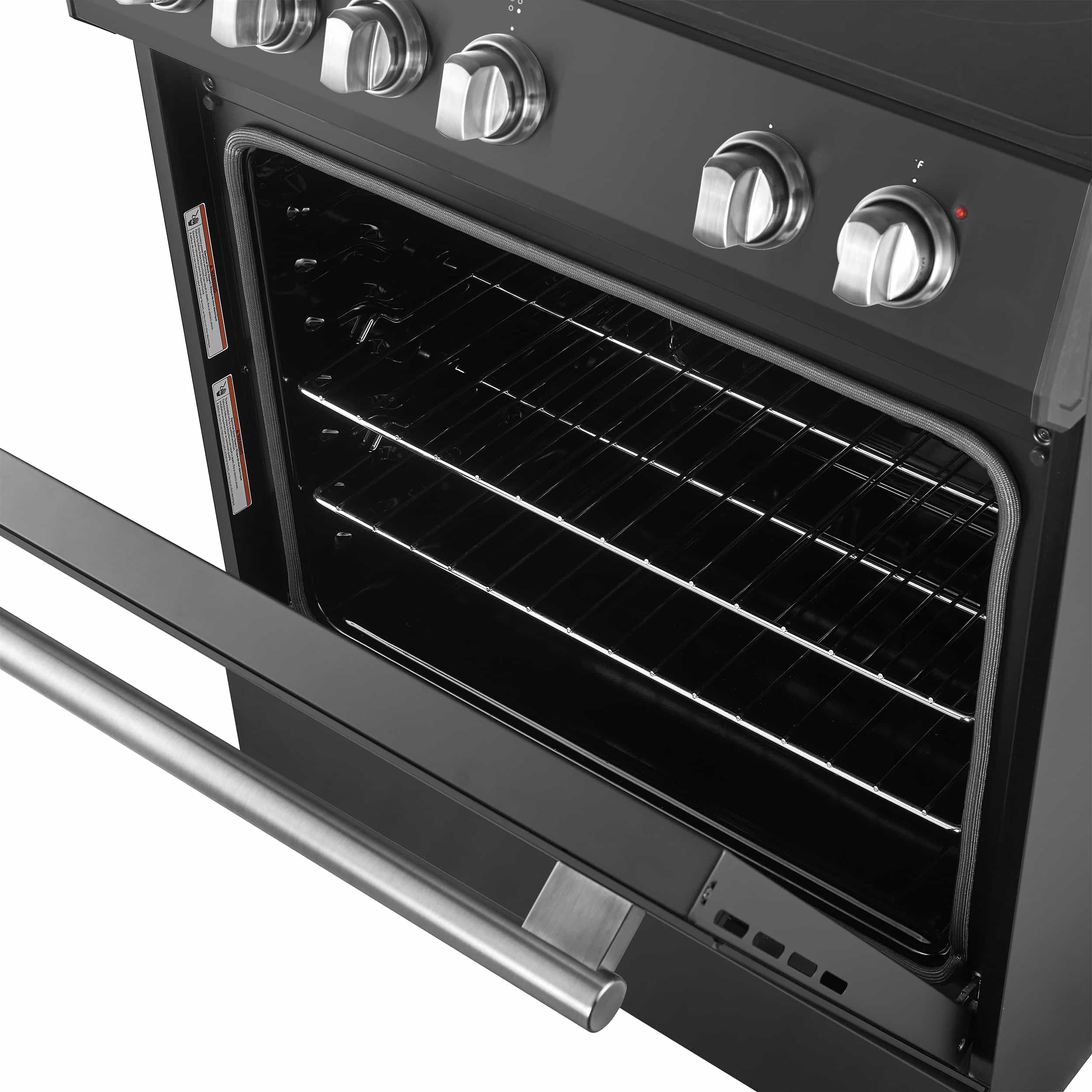 Black electric oven door open with stainless handle and lit wire baking rack