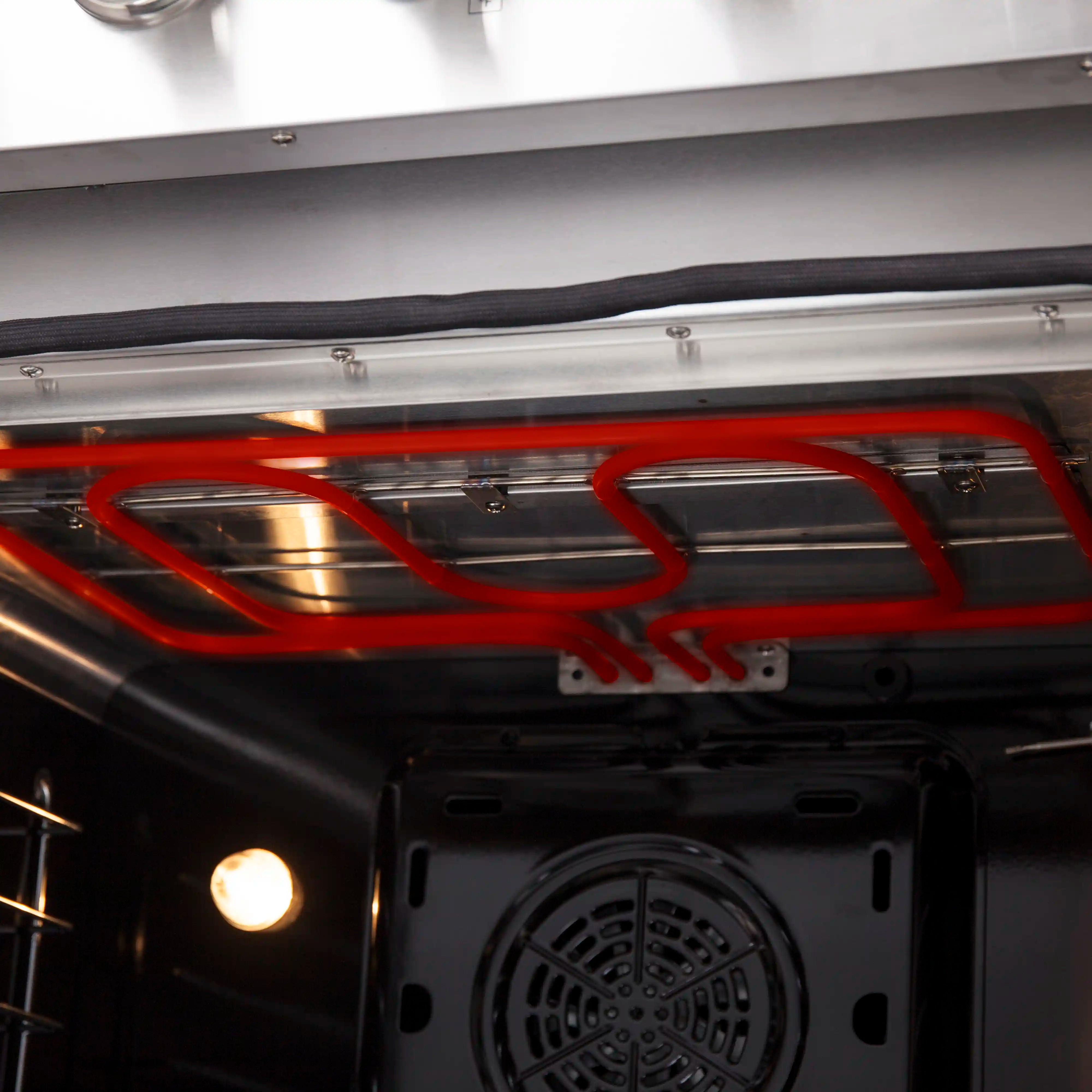 Forno electric oven interior with glowing red heating element above the cavity