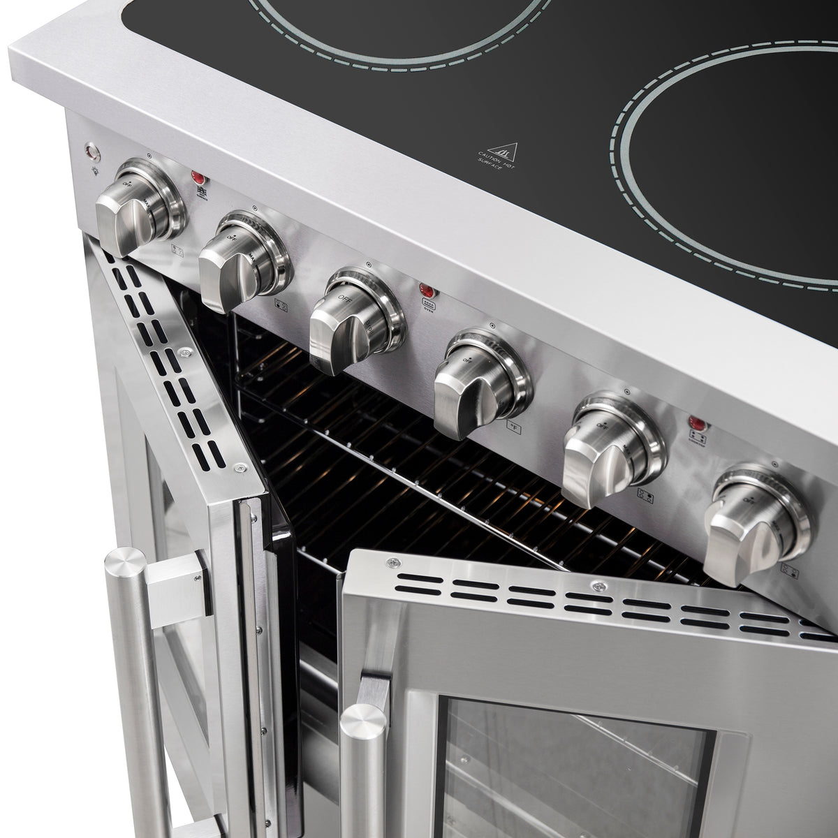 Electric oven interior with wire rack and control knobs along the cooktop back panel