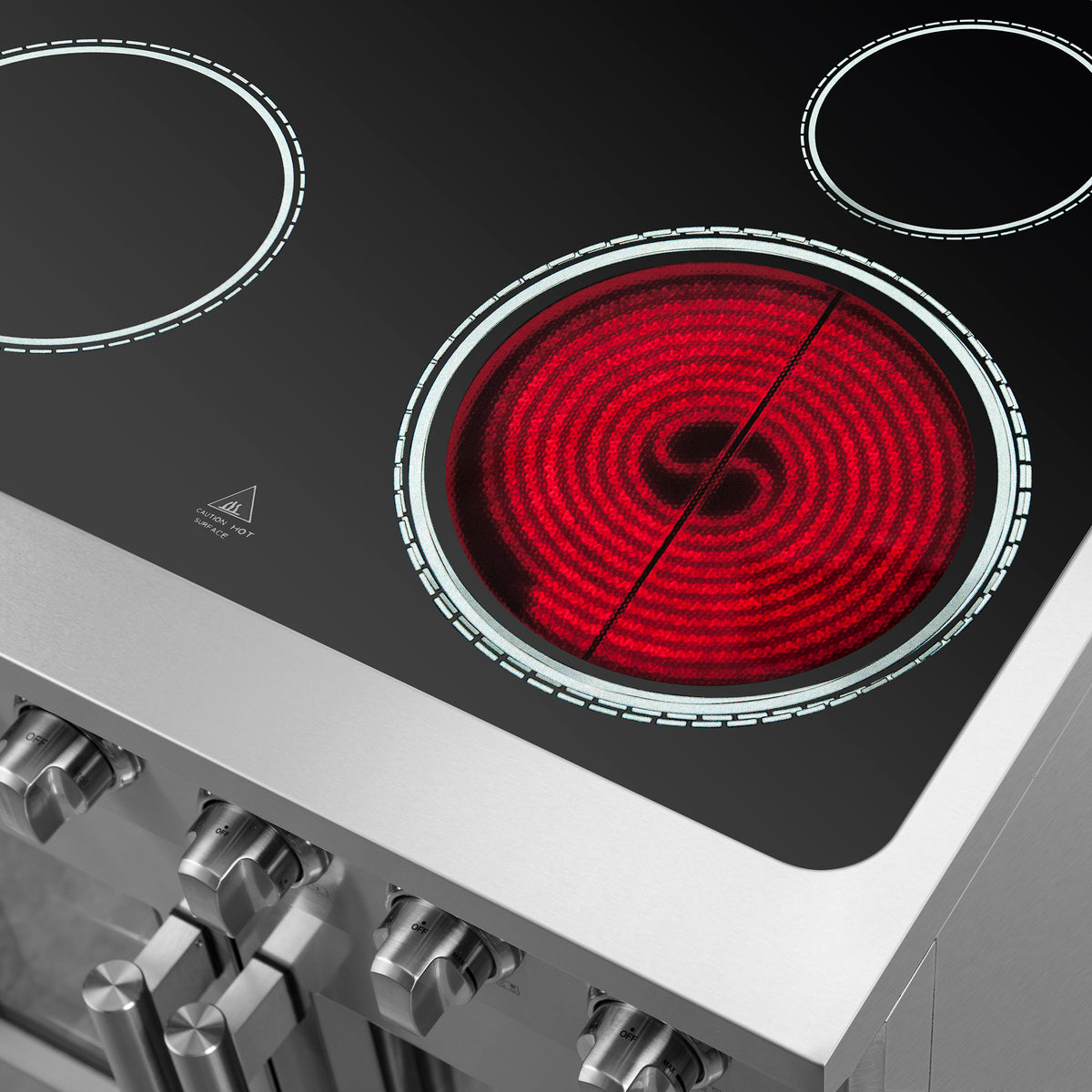 Glass cooktop with four red electric coil burners and illuminated outer rings