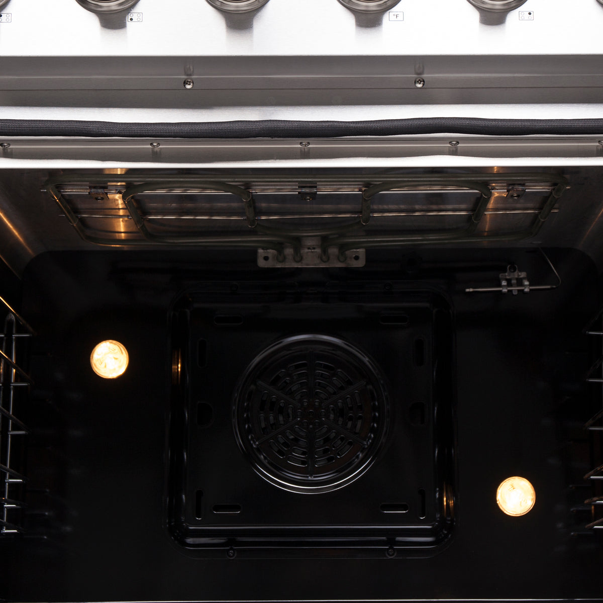 Convection oven floor with heating elements and centered circular fan vent
