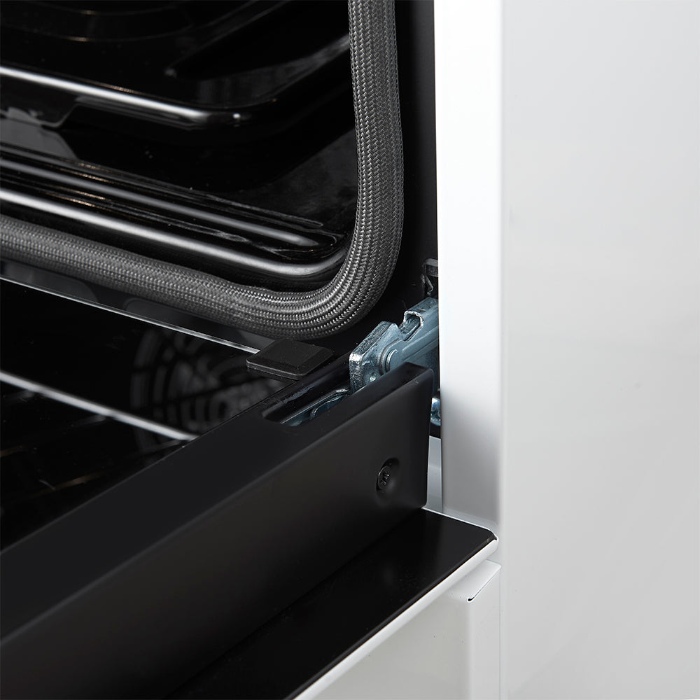 Side view of white gas range oven interior with vent tube and hinge hardware