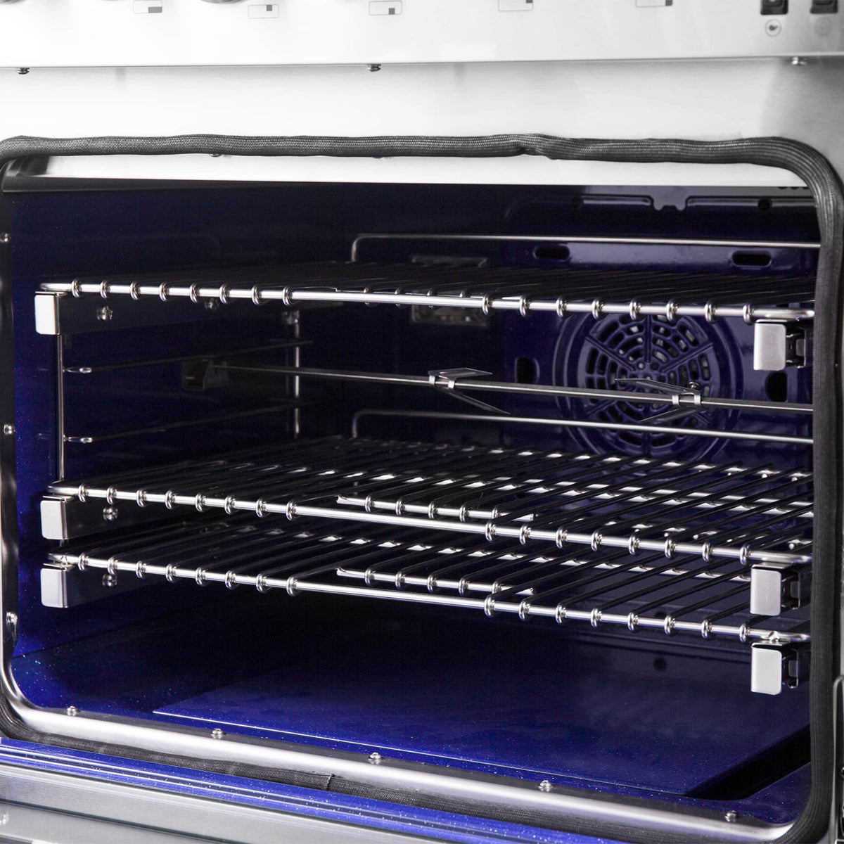 Dual fuel range oven with wire rack shelves and blue enamel interior base