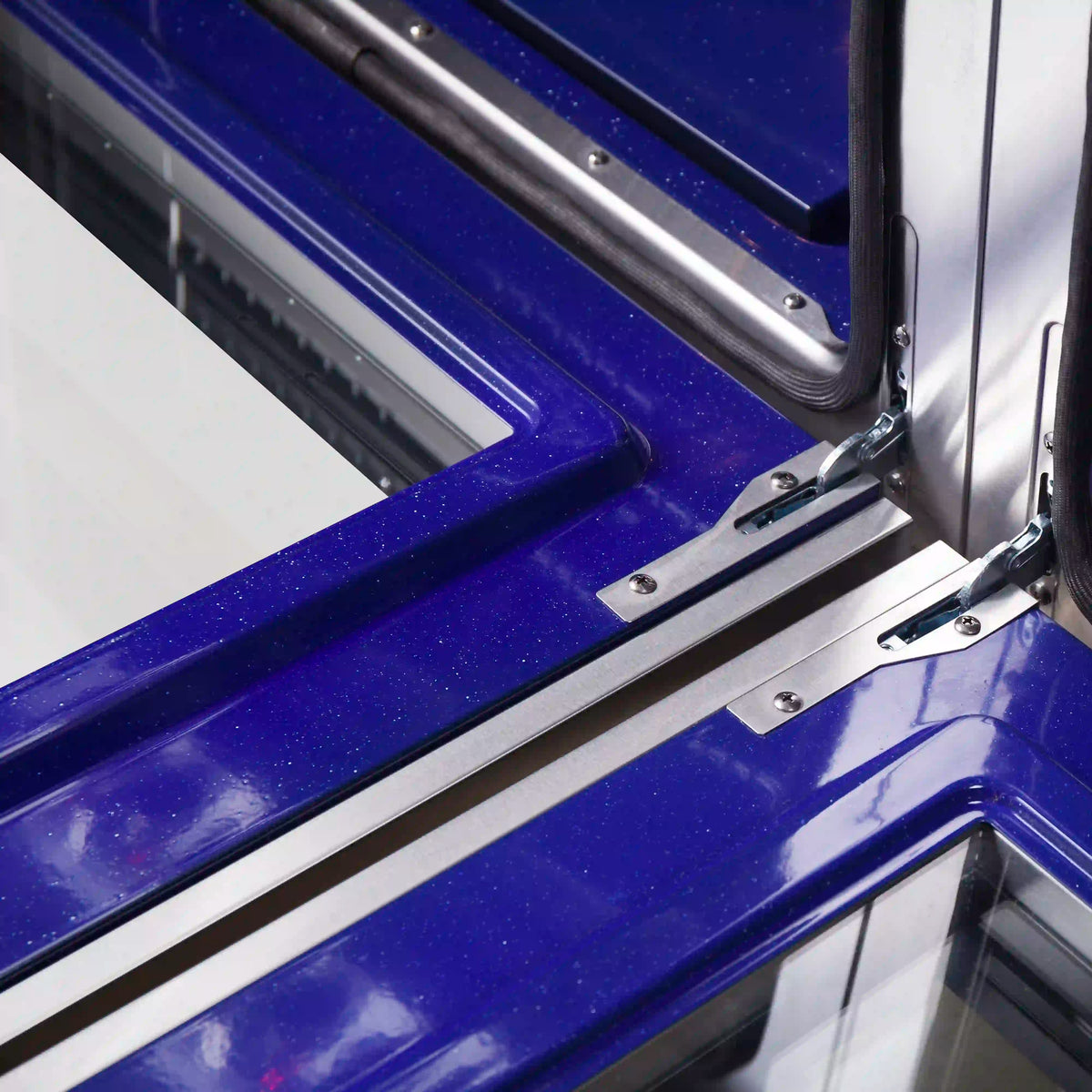 Stainless steel 60-inch gas range oven interior with blue enamel back panel