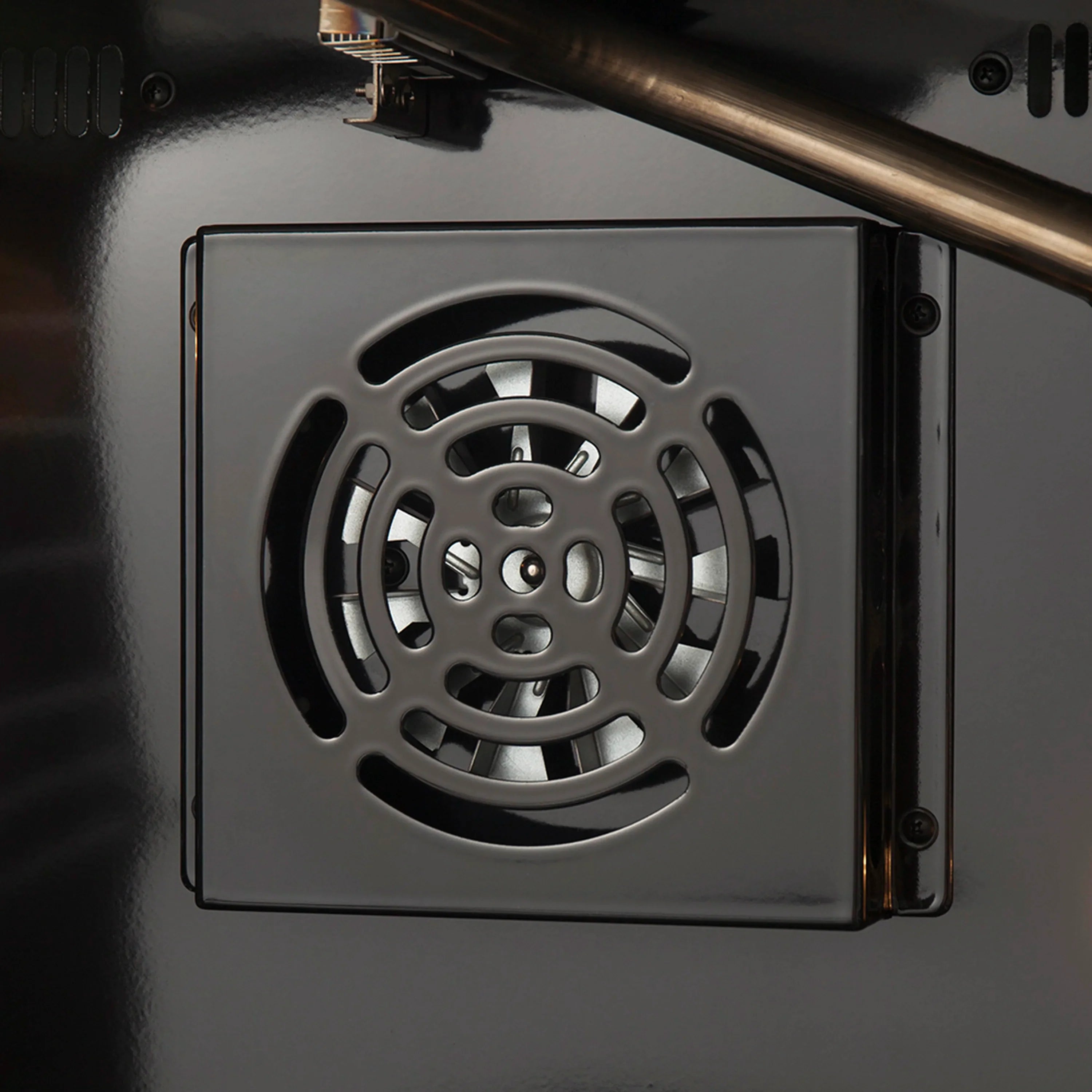 Gas oven control dial on stainless front panel with vented grill