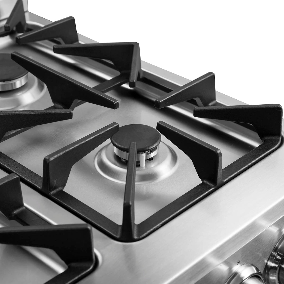 Stainless steel cooktop with four black burner grates and round gas burners.