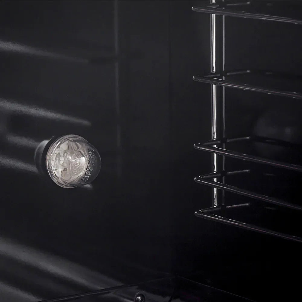 Gas range oven rear burner opening with light and metal baffle