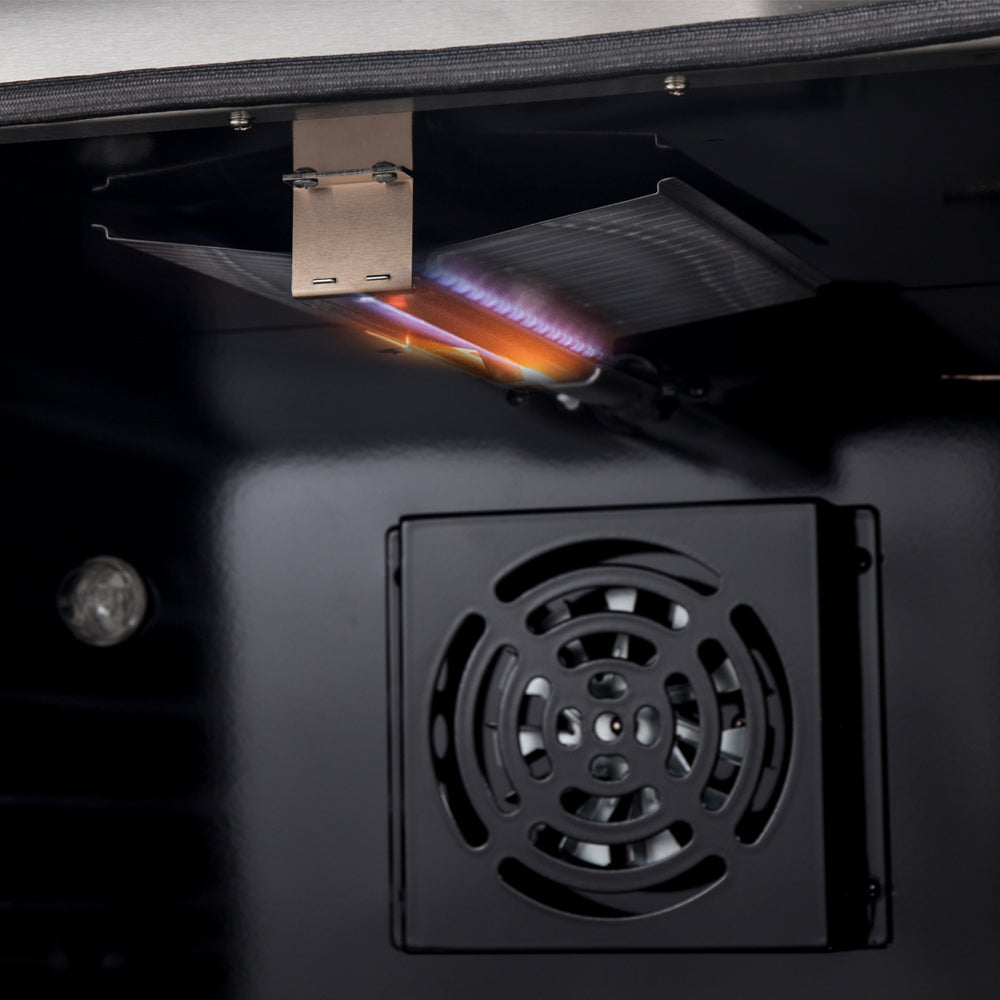 Gas range oven bottom access panel with burner opening, with flame visible