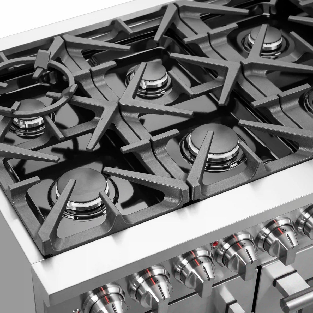 Stainless cooktop with five gas burners and cast-iron grates, plus control knobs.