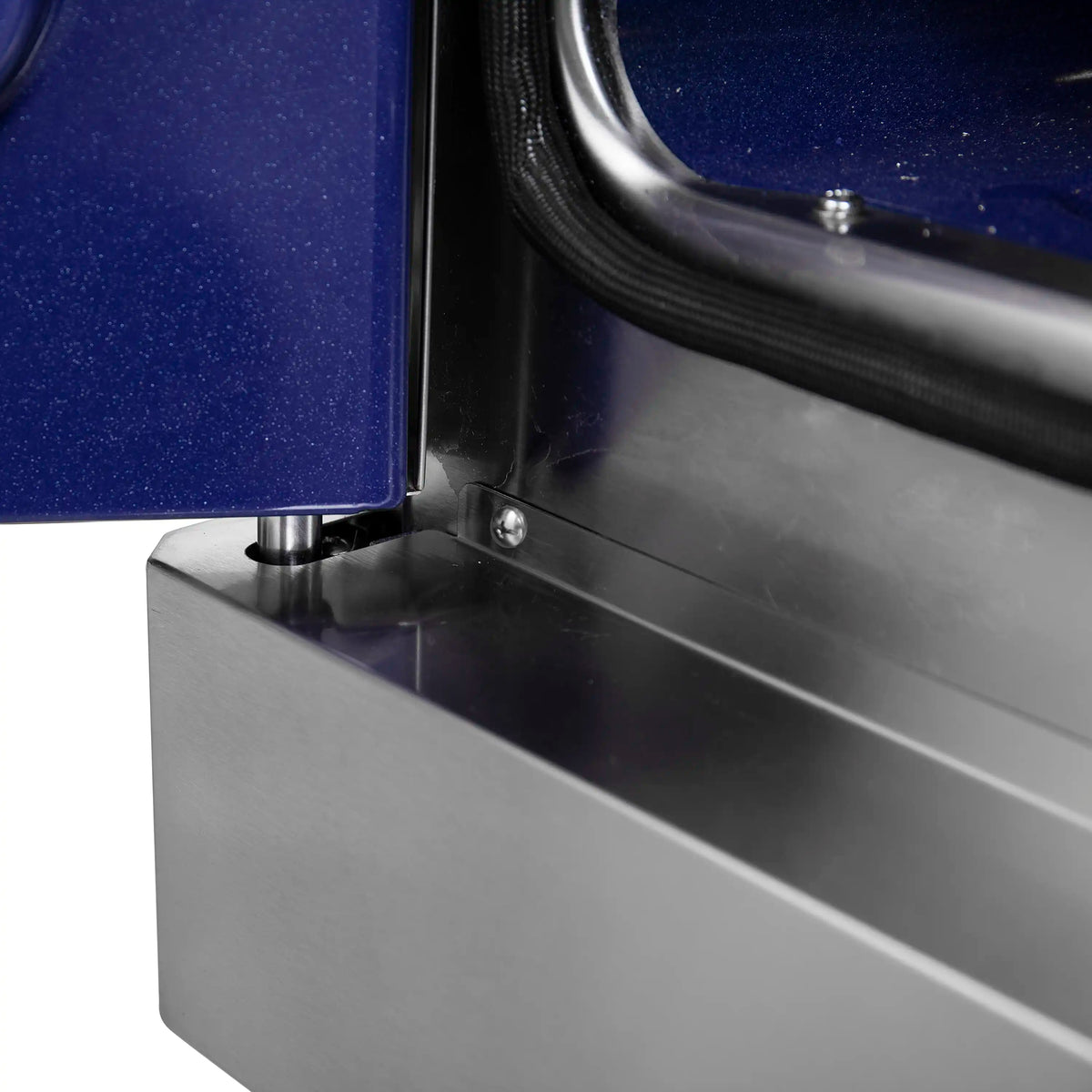 Oven door frame corner with stainless metal and blue insulated panel