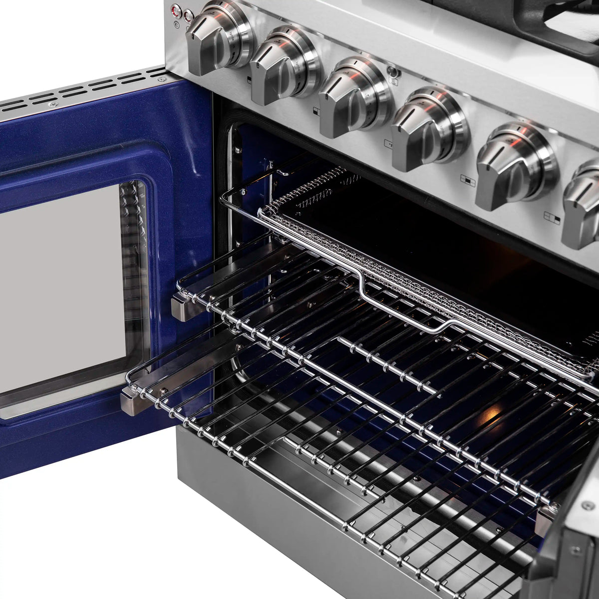 Open gas oven with wire racks and stainless control panel above