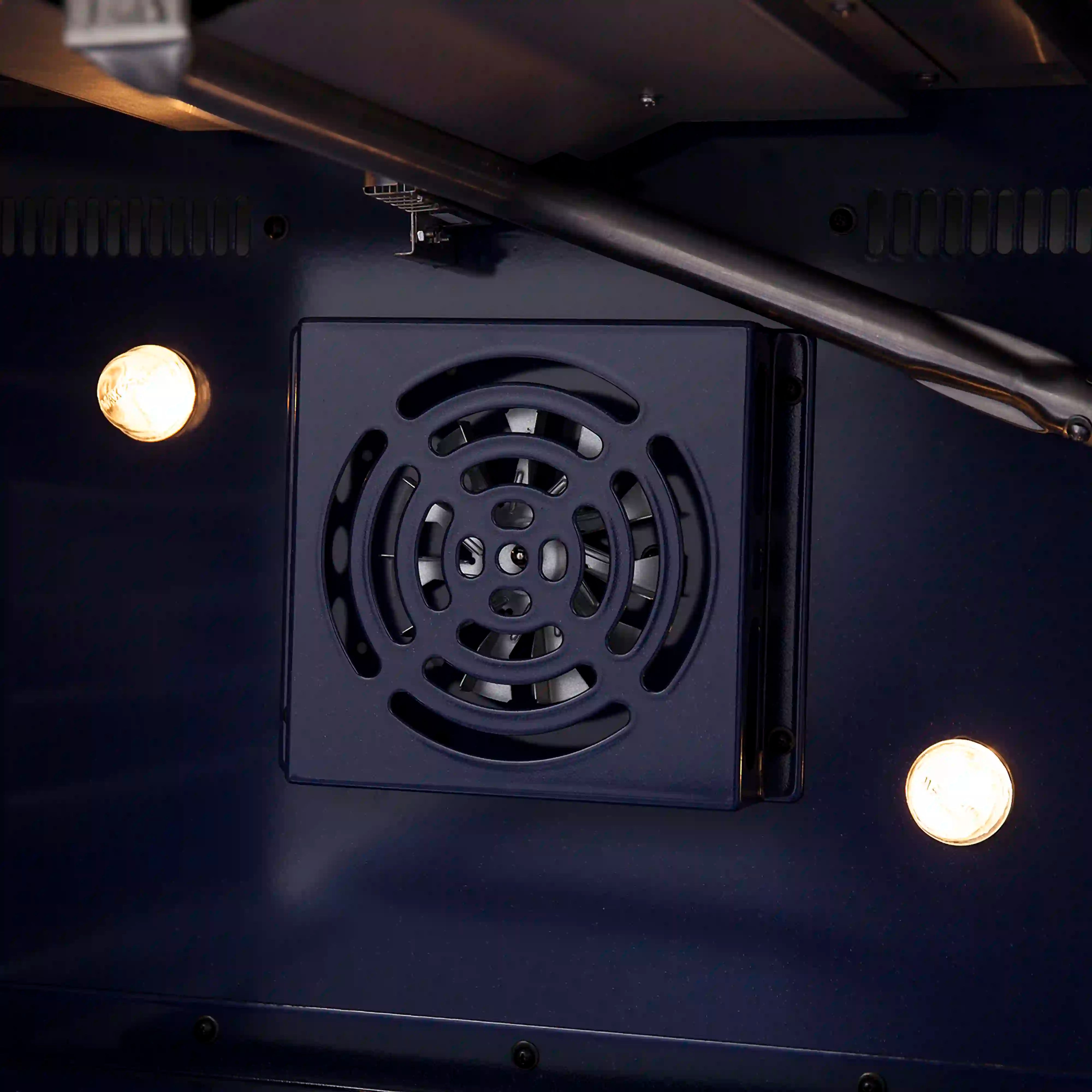Gas range oven rear fan vent panel and circular fan grille