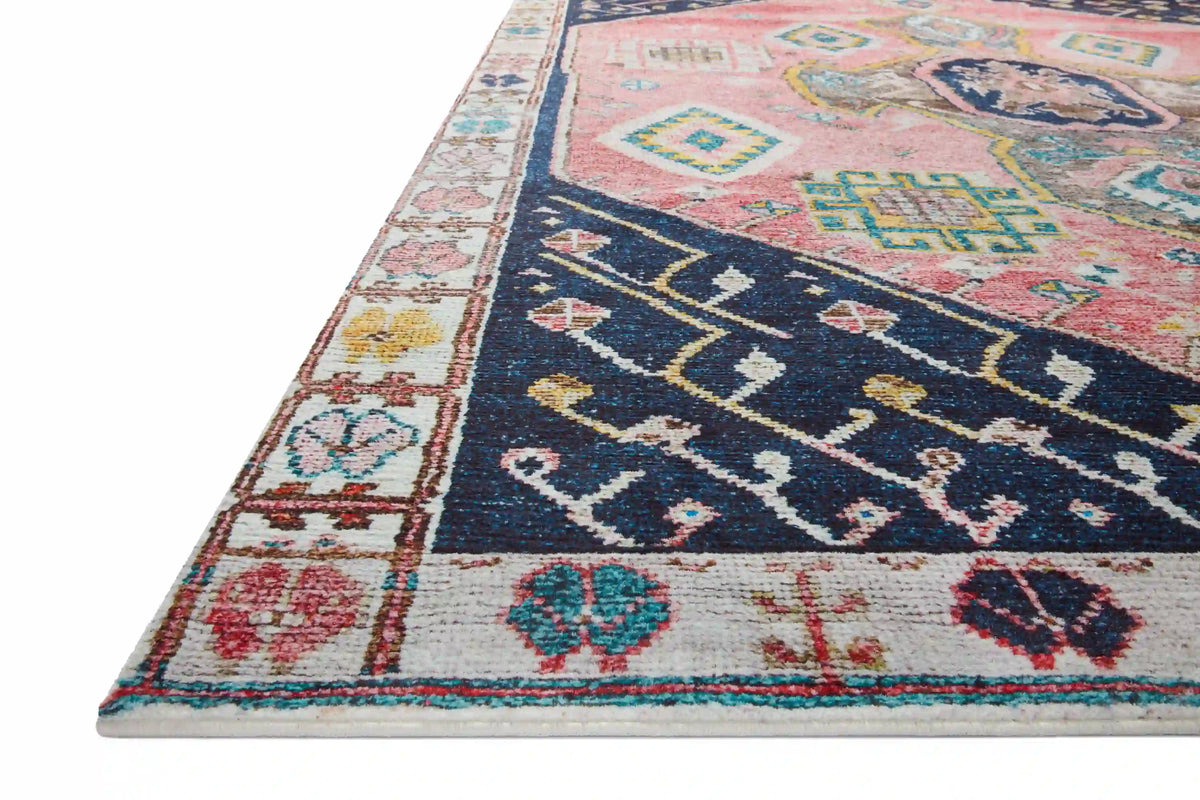 Multicolor vintage-style area rug with navy, rust, and patterned border; geometric medallion