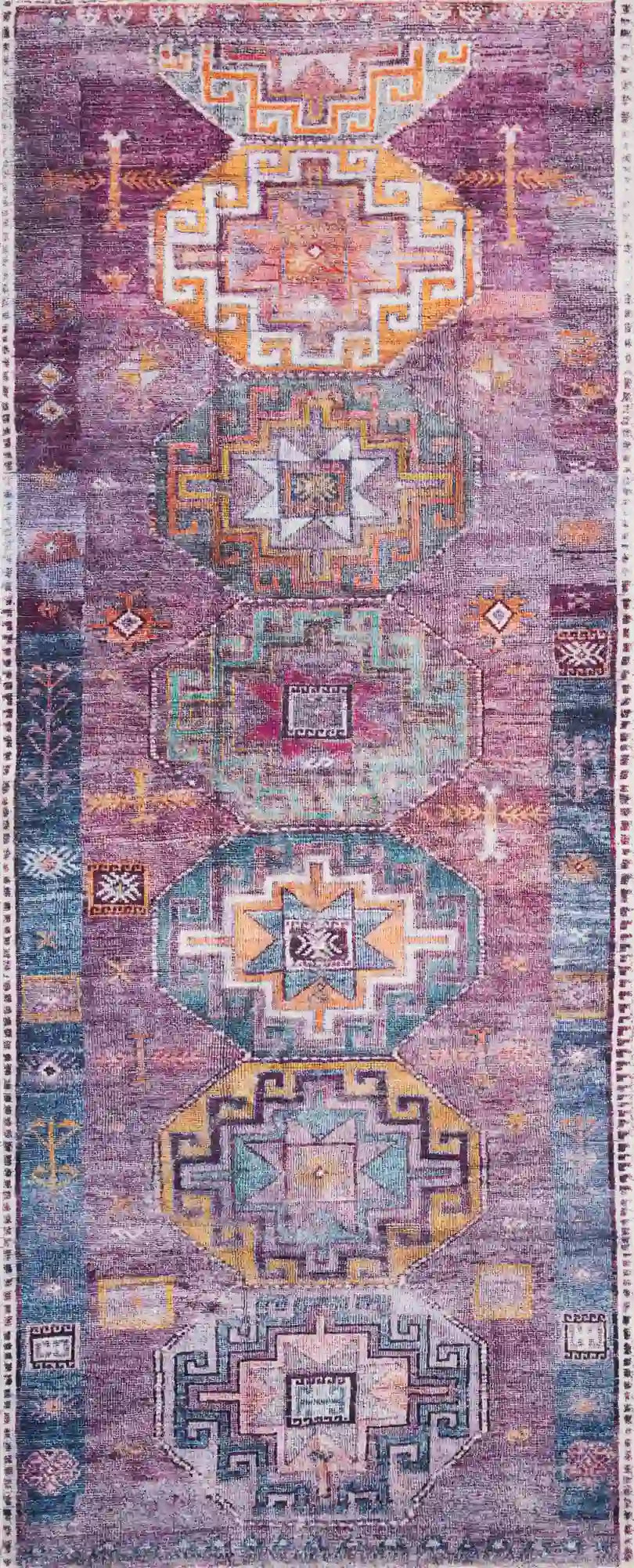 Geometric accent rug with purple, blue, and pink medallion pattern, border detail