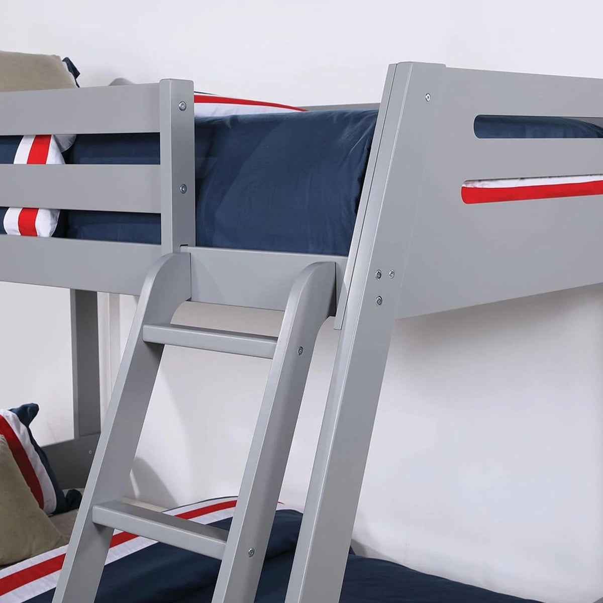 Gray bunk bed ladder and guardrails with striped bedding, underbed access below