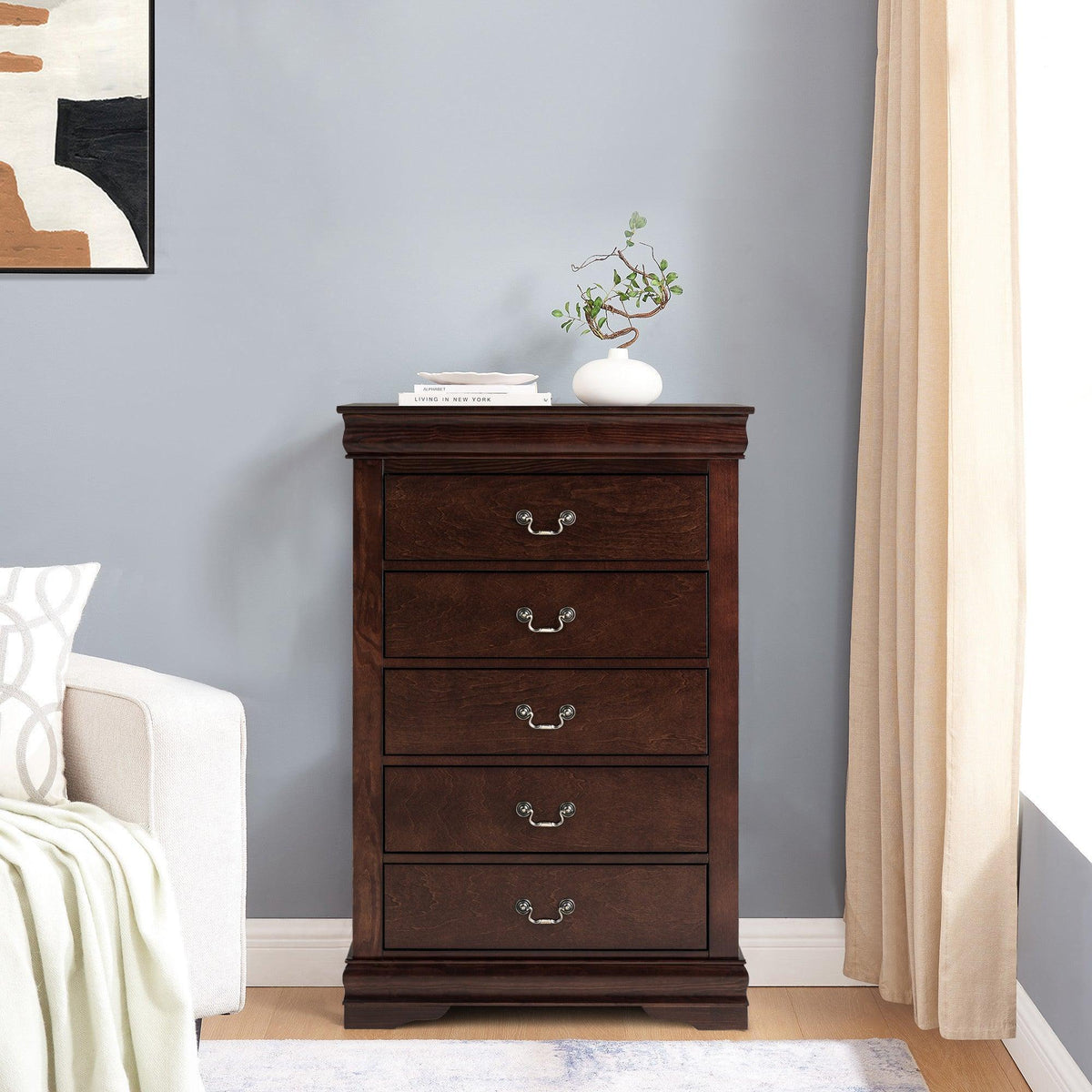 Brown wooden chest of drawers with five drawers and curved metal pulls.
