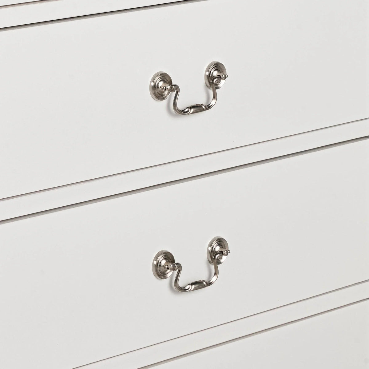 White chest drawers with silver U-shaped pull handles