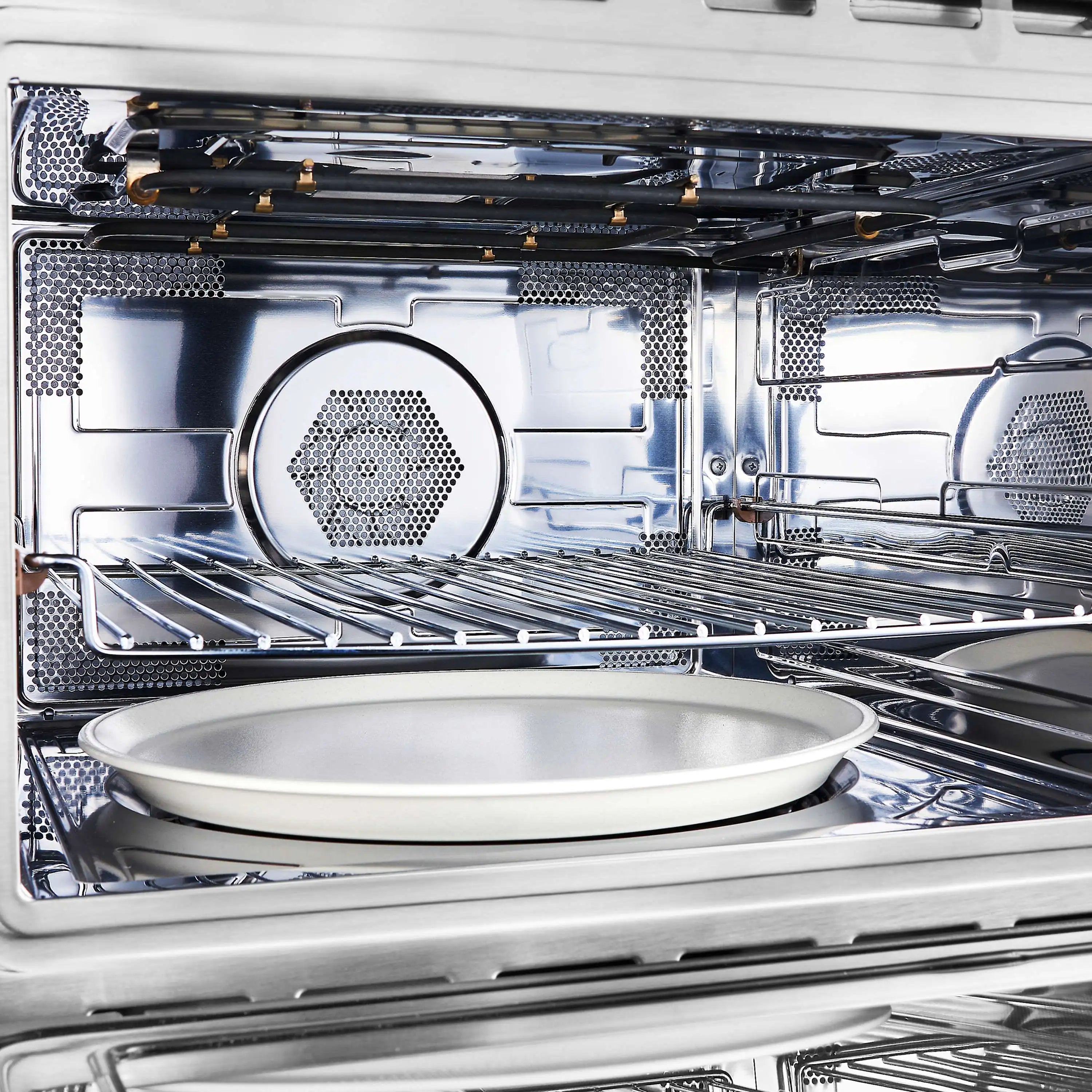 Stainless microwave drawer interior with round turntable and wire rack