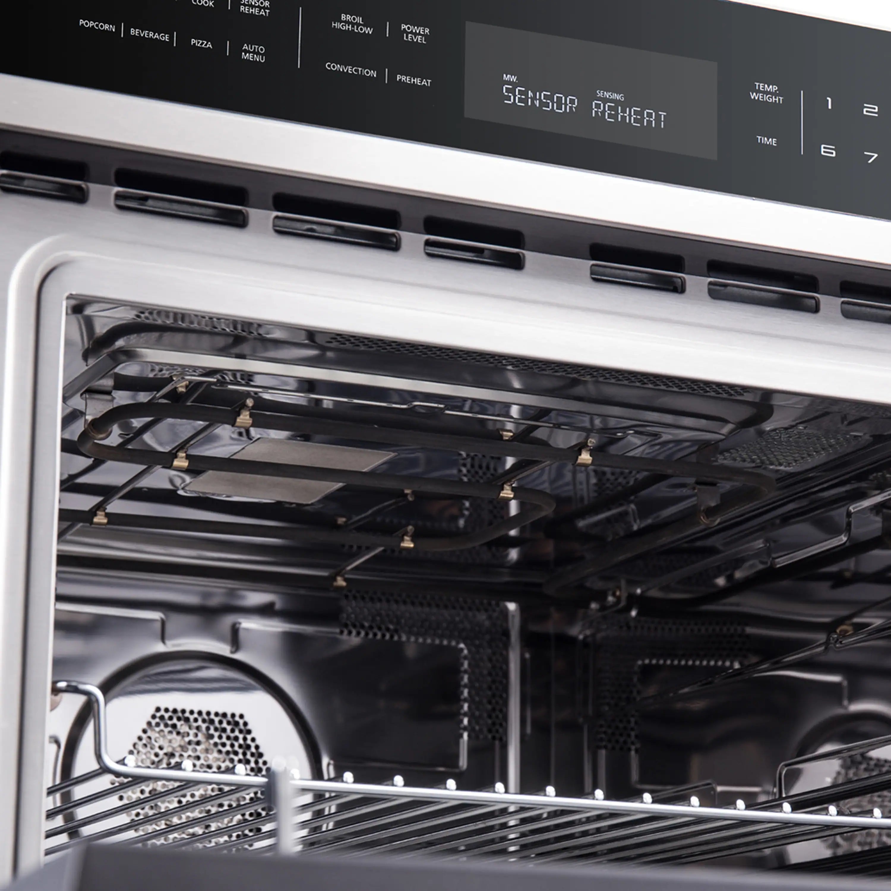 Stainless steel single wall oven interior view with racks and back heating element