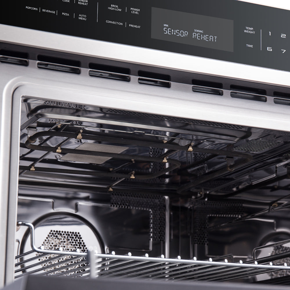 Microwave oven interior with metal rack, tray supports, and ventilation vents