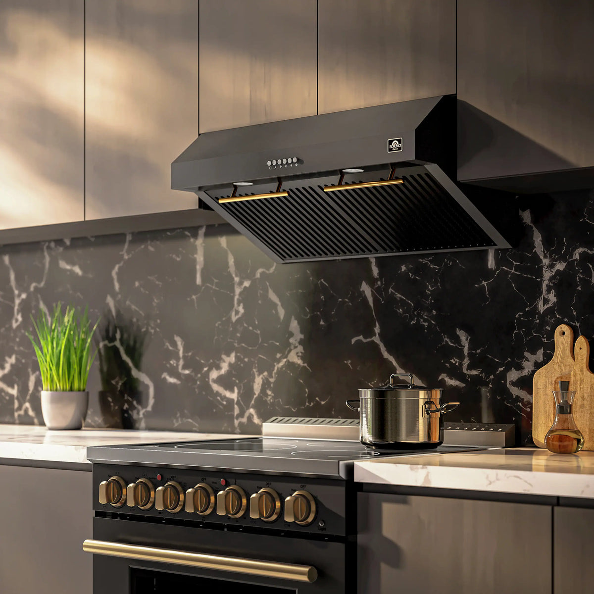 Black under-cabinet range hood with slotted vent and warm brass-accented lighting