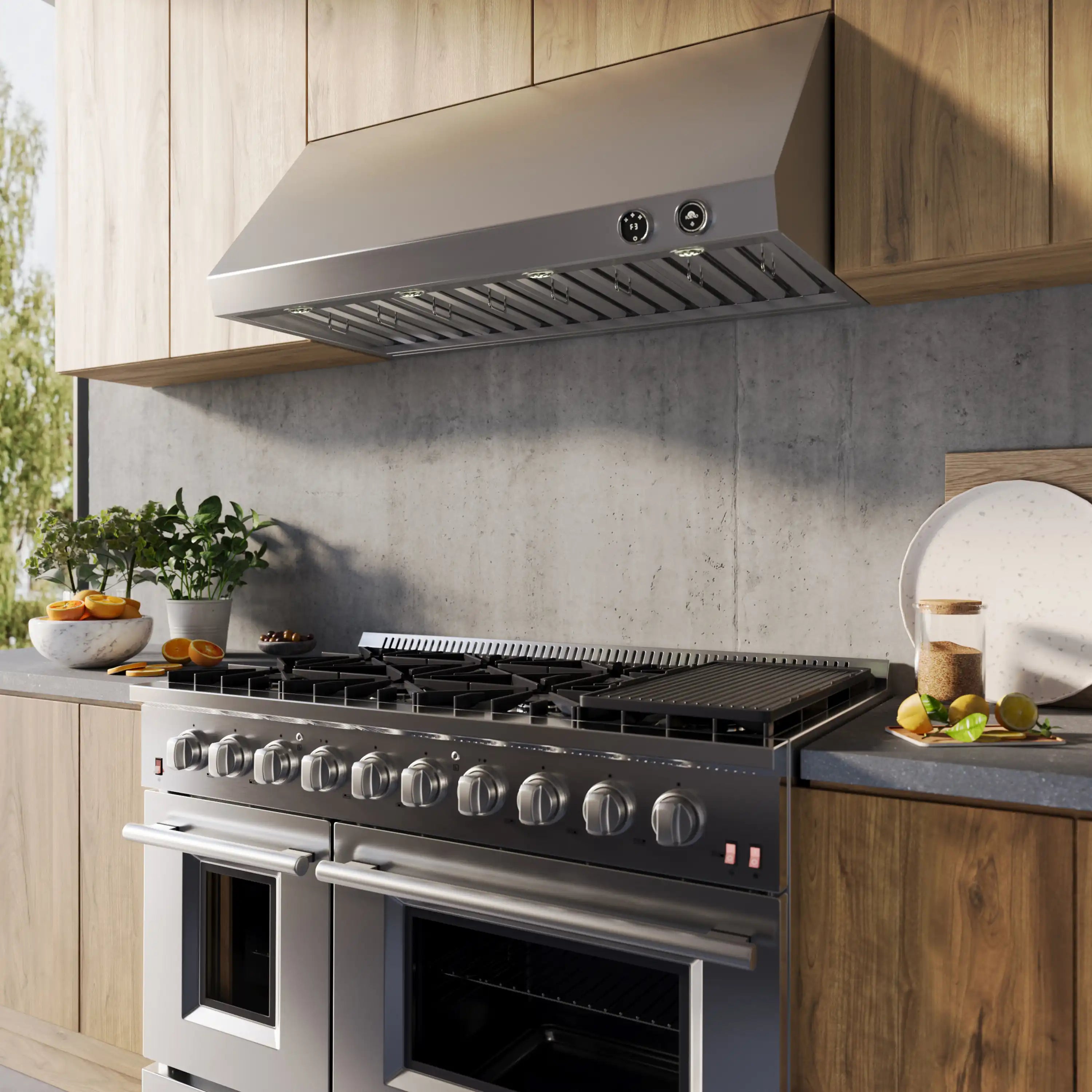 Stainless steel under-cabinet range hood with vent grille and fan button controls