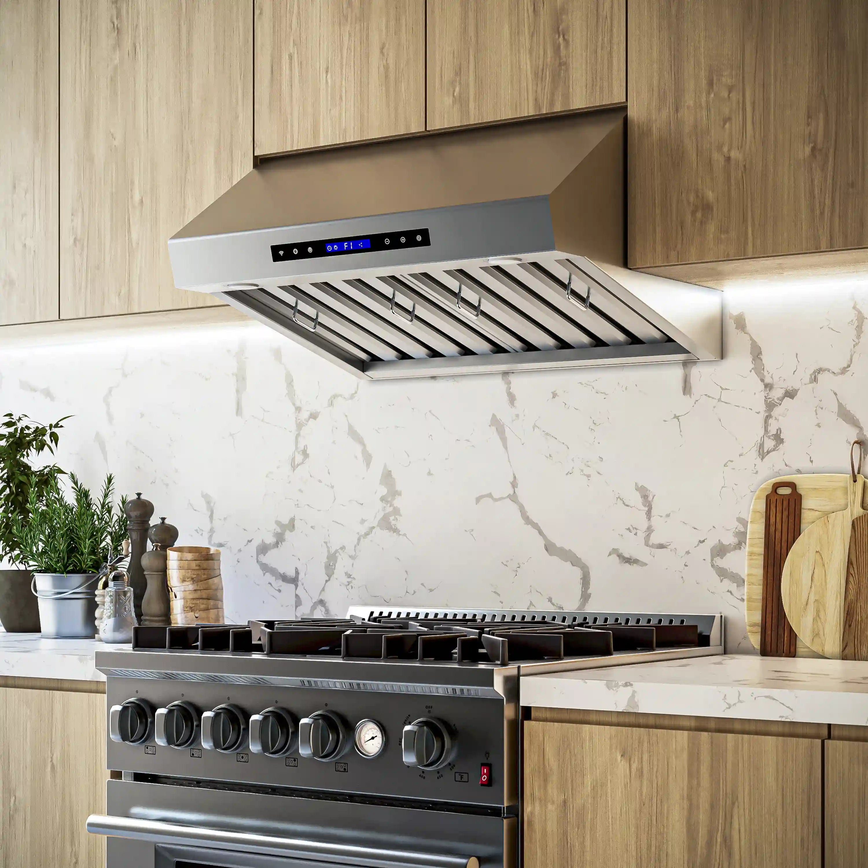 Stainless steel under-cabinet range hood installed with vent grille and blue LED display