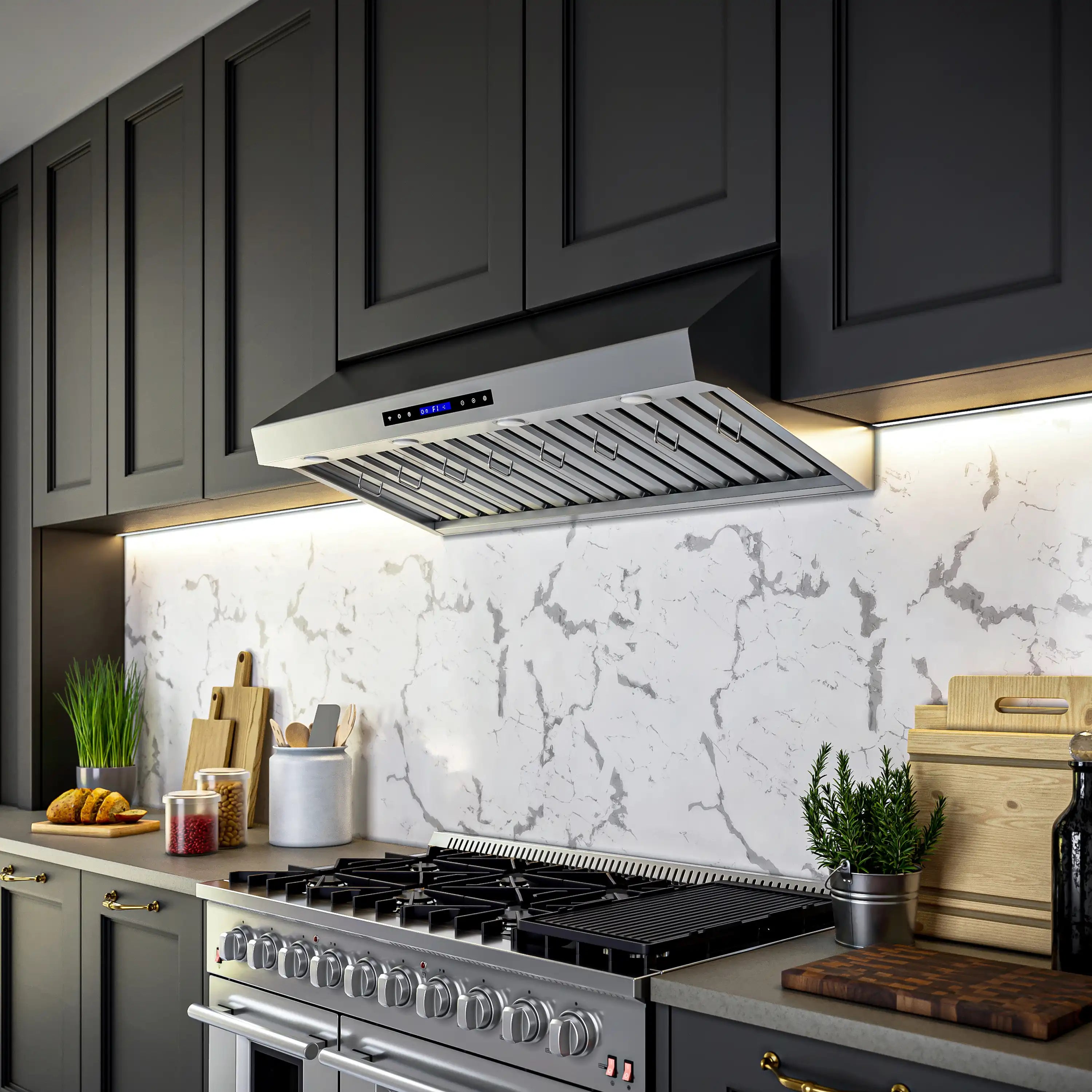Stainless steel under-cabinet range hood installed under cabinets with baffle filters and light