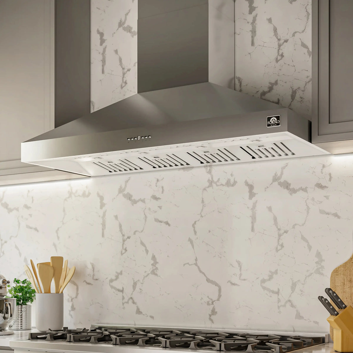Wall-mounted stainless steel range hood with front vent grille and control buttons