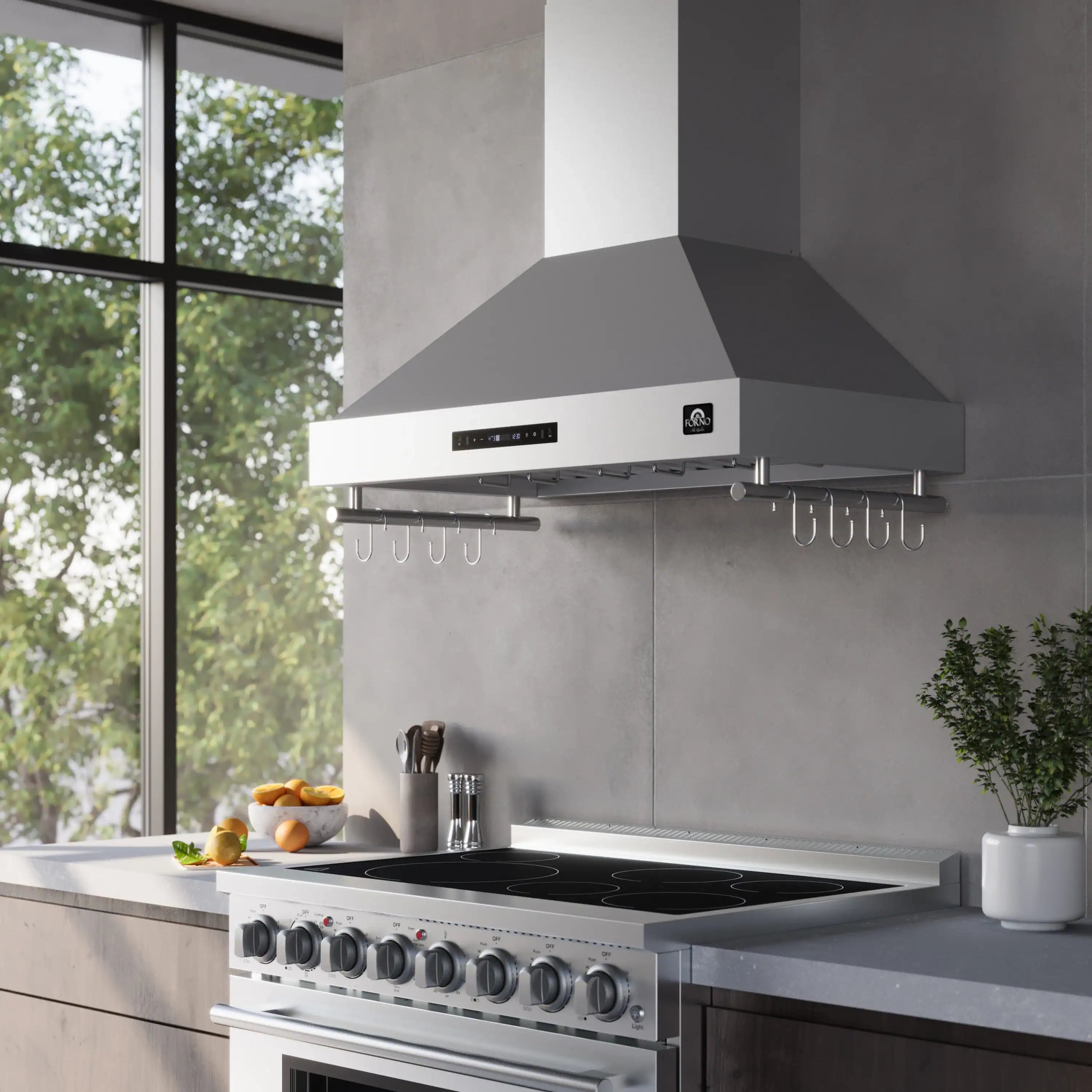 Stainless steel wall range hood over cooktop with hanging utensil hooks