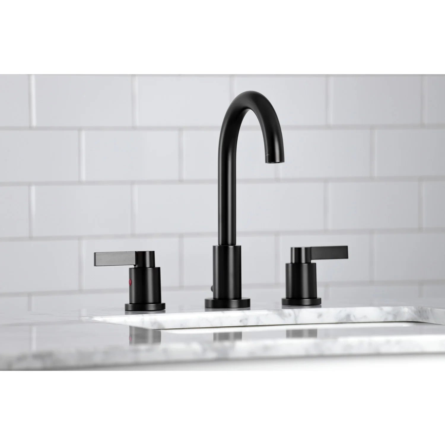 Matte black widespread faucet with arched spout and two cross handles on sink