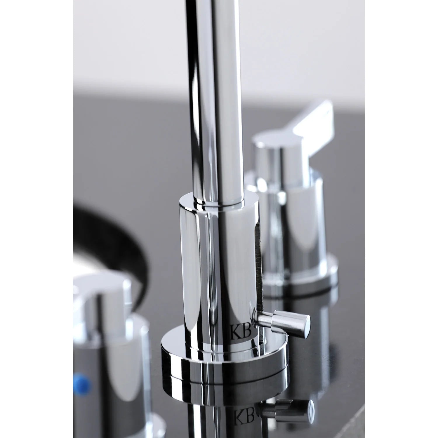 Polished chrome faucet with lever handles and base, blue indicator detail