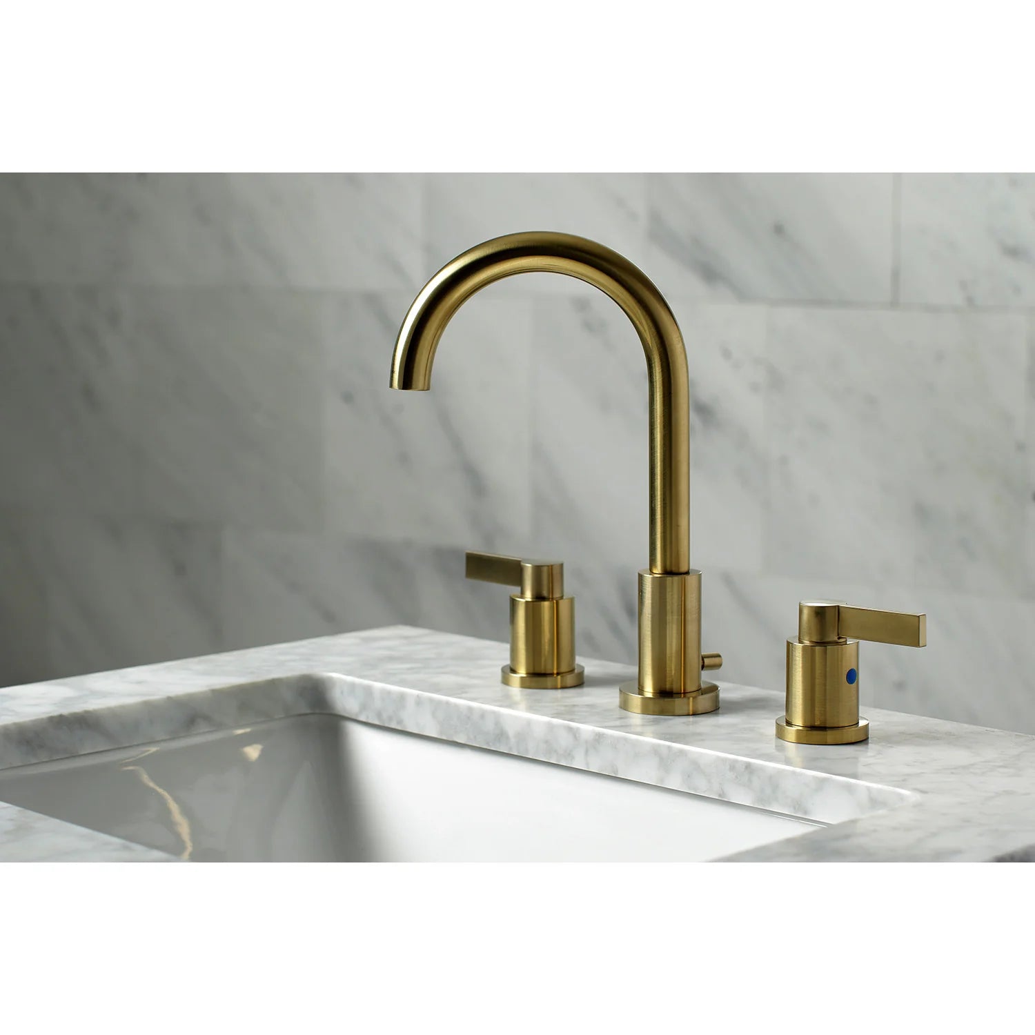 Brushed brass widespread bathroom faucet with curved spout and two lever handles