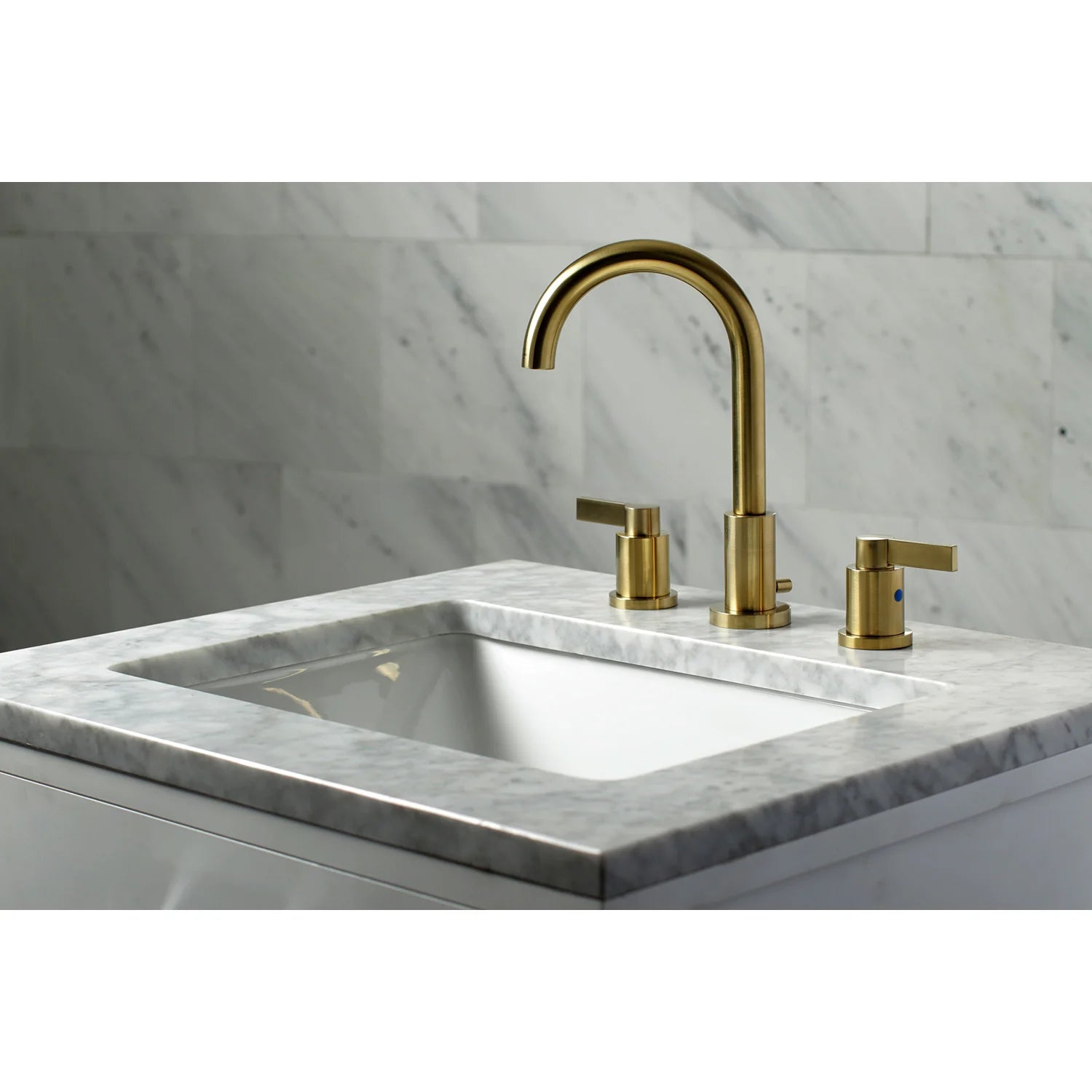 Brushed brass widespread bathroom faucet set with spout, handles, and deck mount