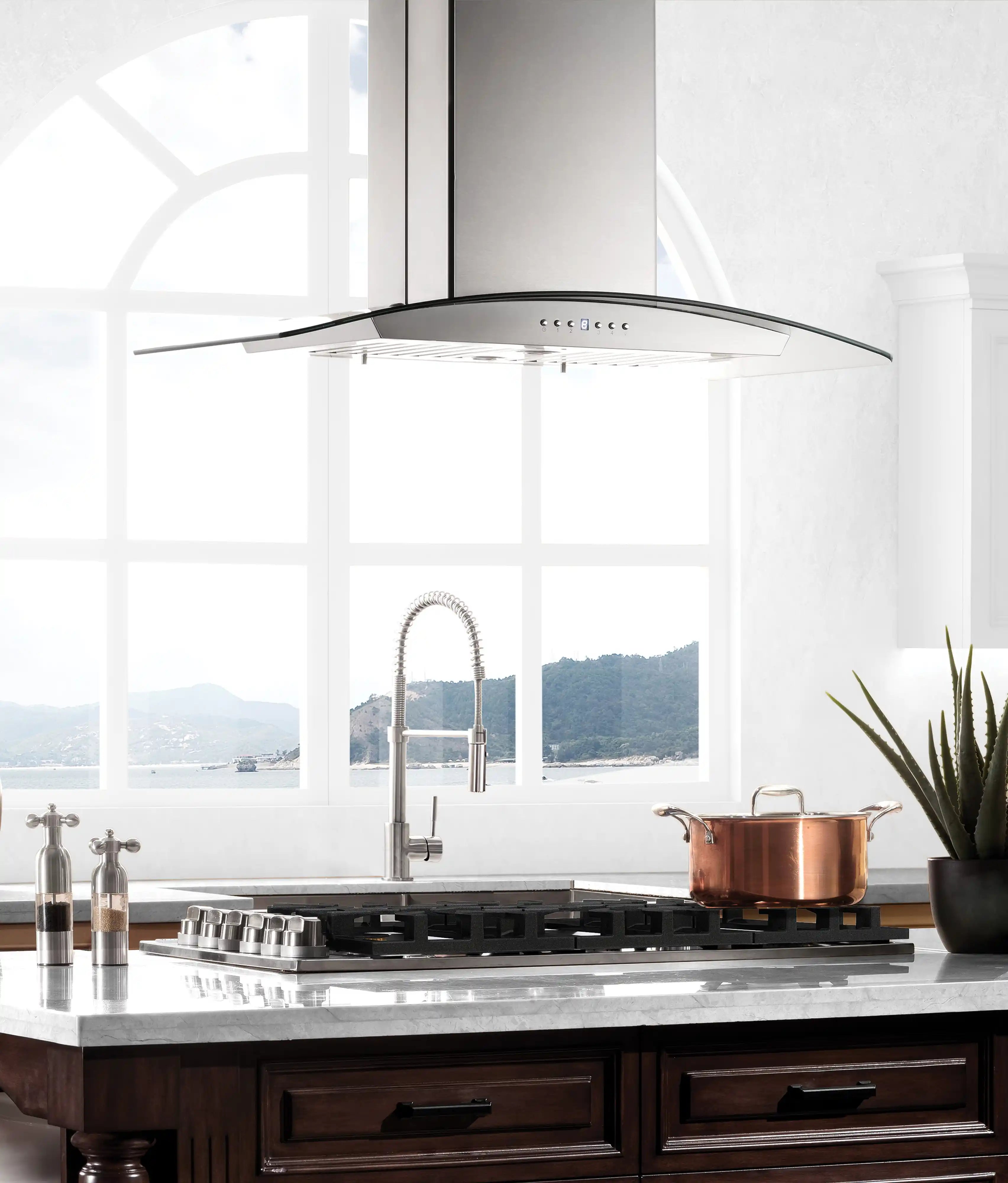 Gas cooktop installed in kitchen with black grates and stainless cooktop frame