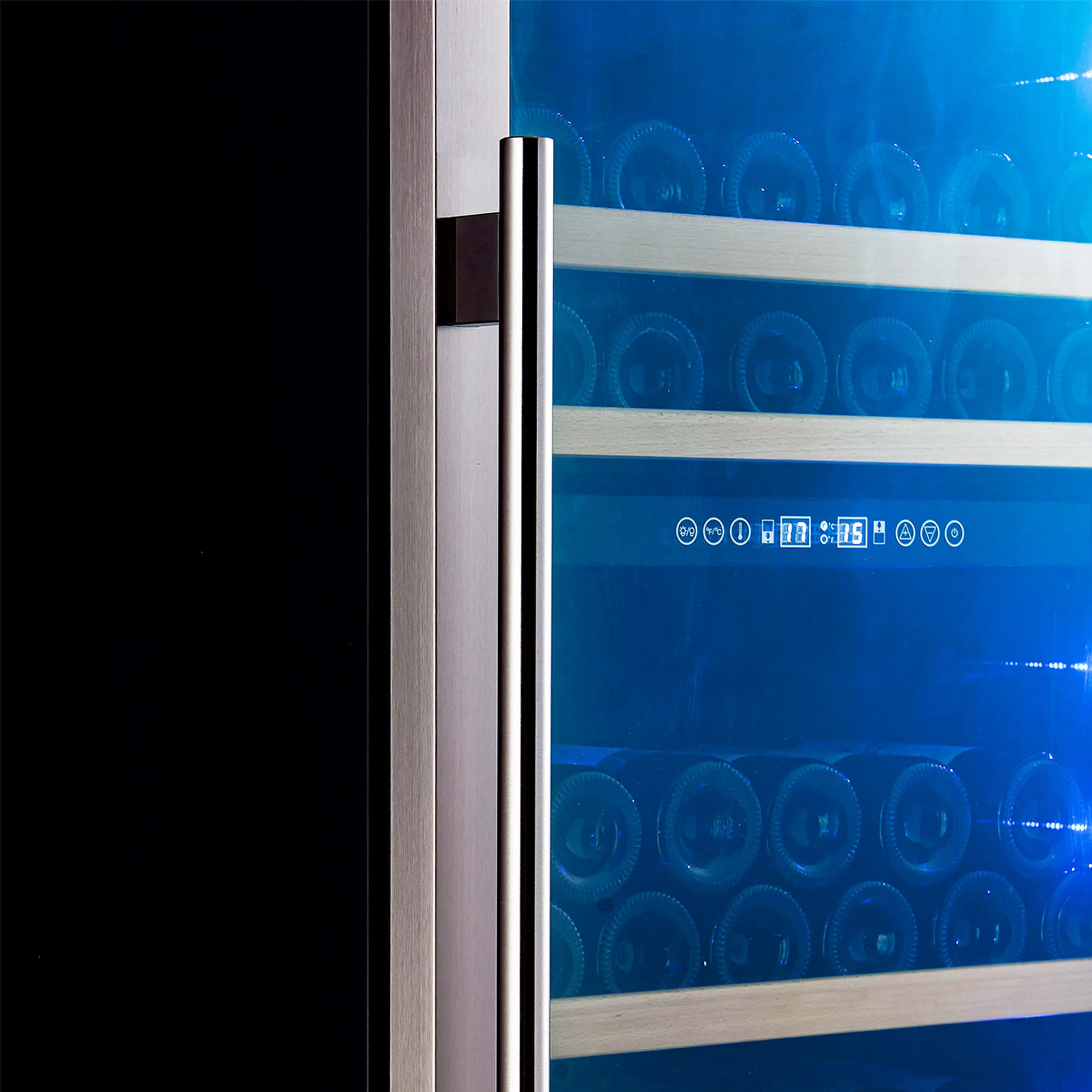 Wine cooler door handle and control area beside blue-lit interior racks