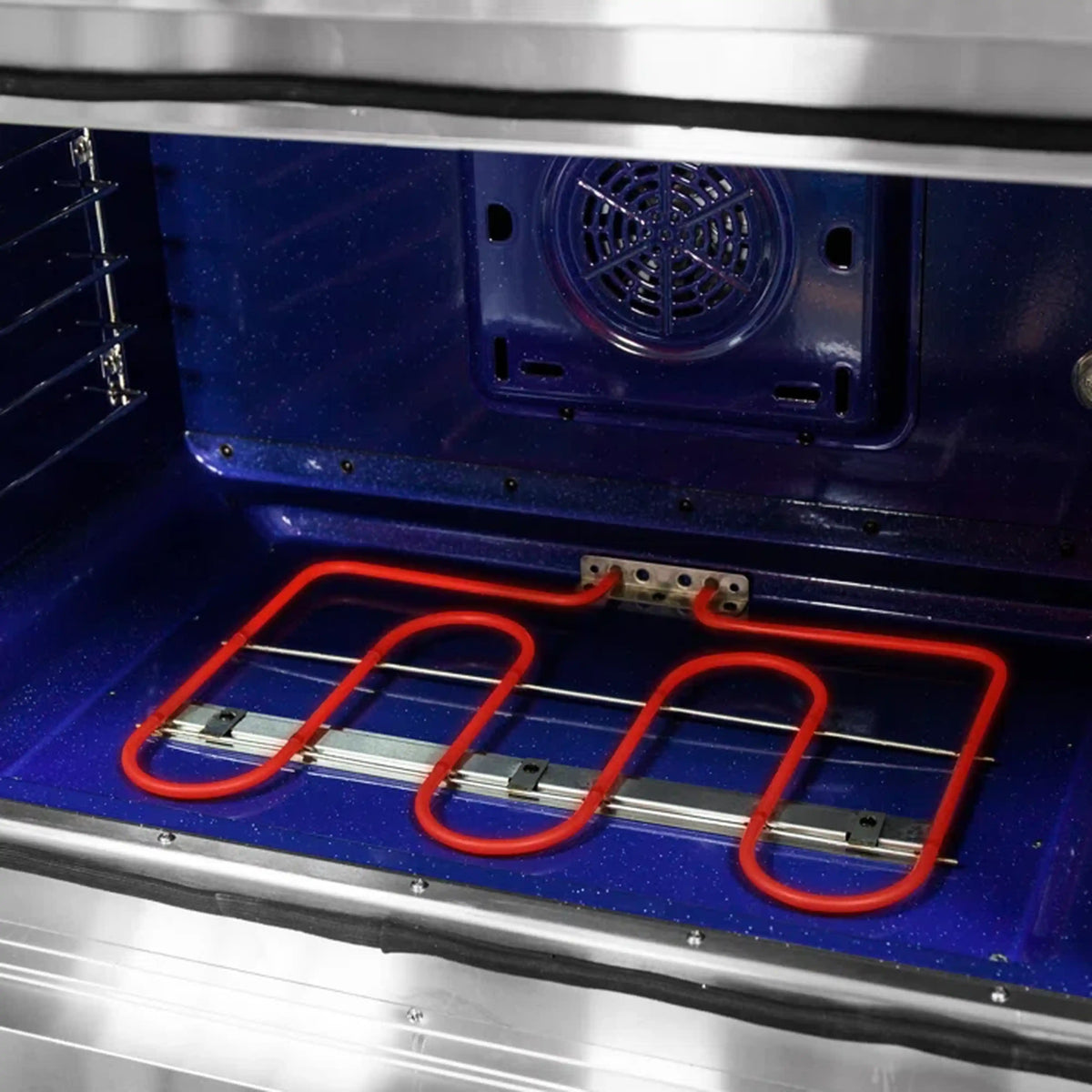 Dual fuel range oven bottom with red gas burner frame over blue enamel