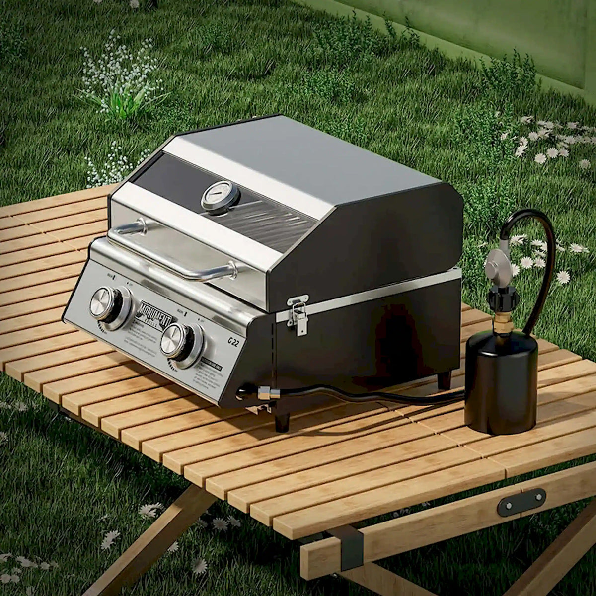 Stainless tabletop propane gas grill with lid and front control knobs