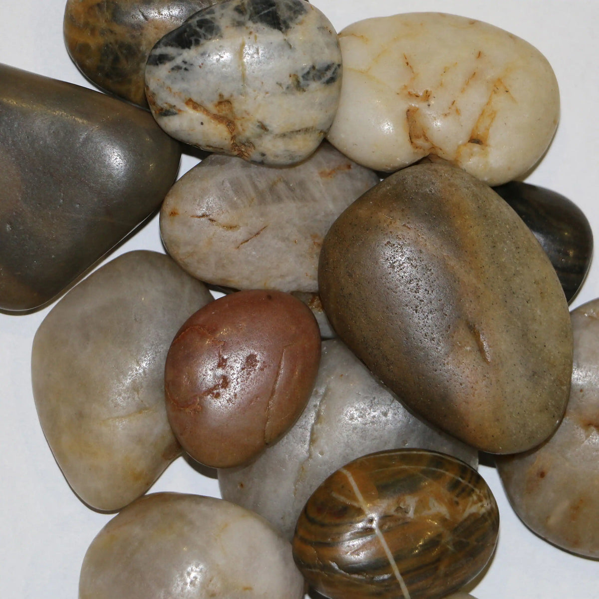 Mixed faux river stones in tan, brown, and grey for the firebox